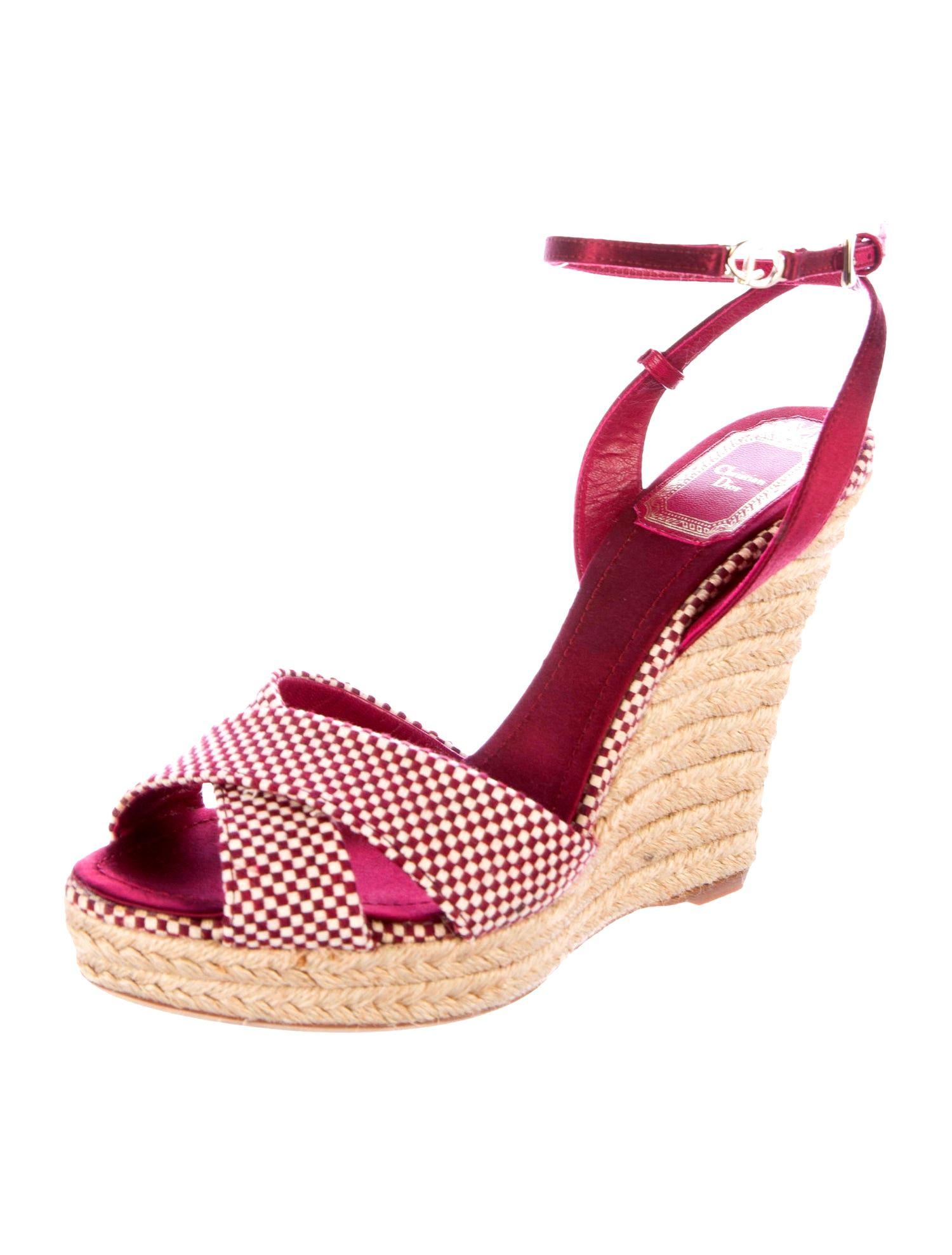 If you're already a fan of wedge heel espadrilles, you'll love this pair Christian Dior - they're set on a jute wedge heel for comfortable lift. 
Wear them on vacation with pretty dresses or cuffed denim.

Beautiful burgundy and creme satin