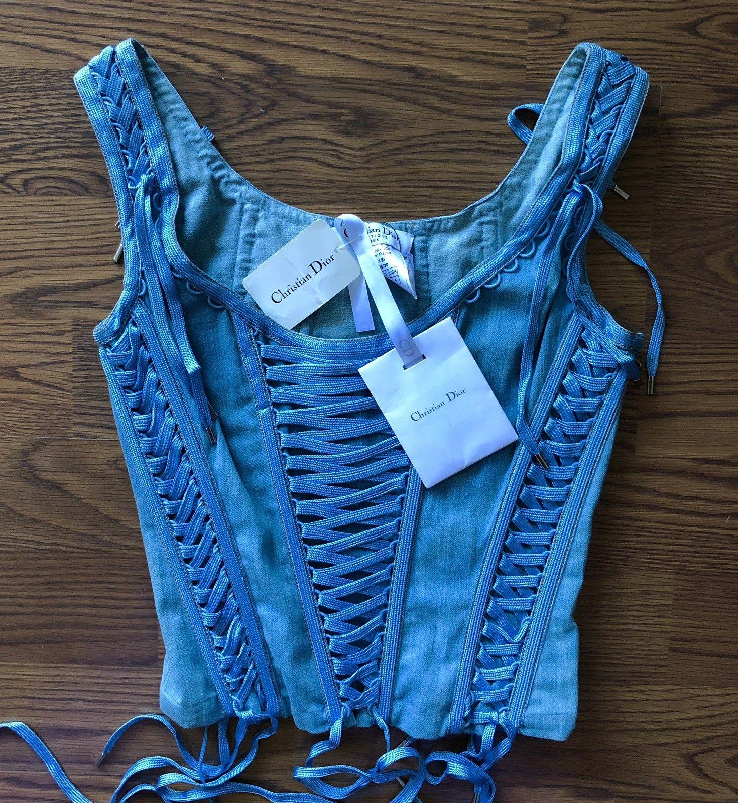 New Christian Dior by John Galliano S/S 2002 Denim Bustier Corset Top FR 38

Medium wash blue Christian Dior denim corset with lace-up detail throughout, boning at interior and side zip closure.
