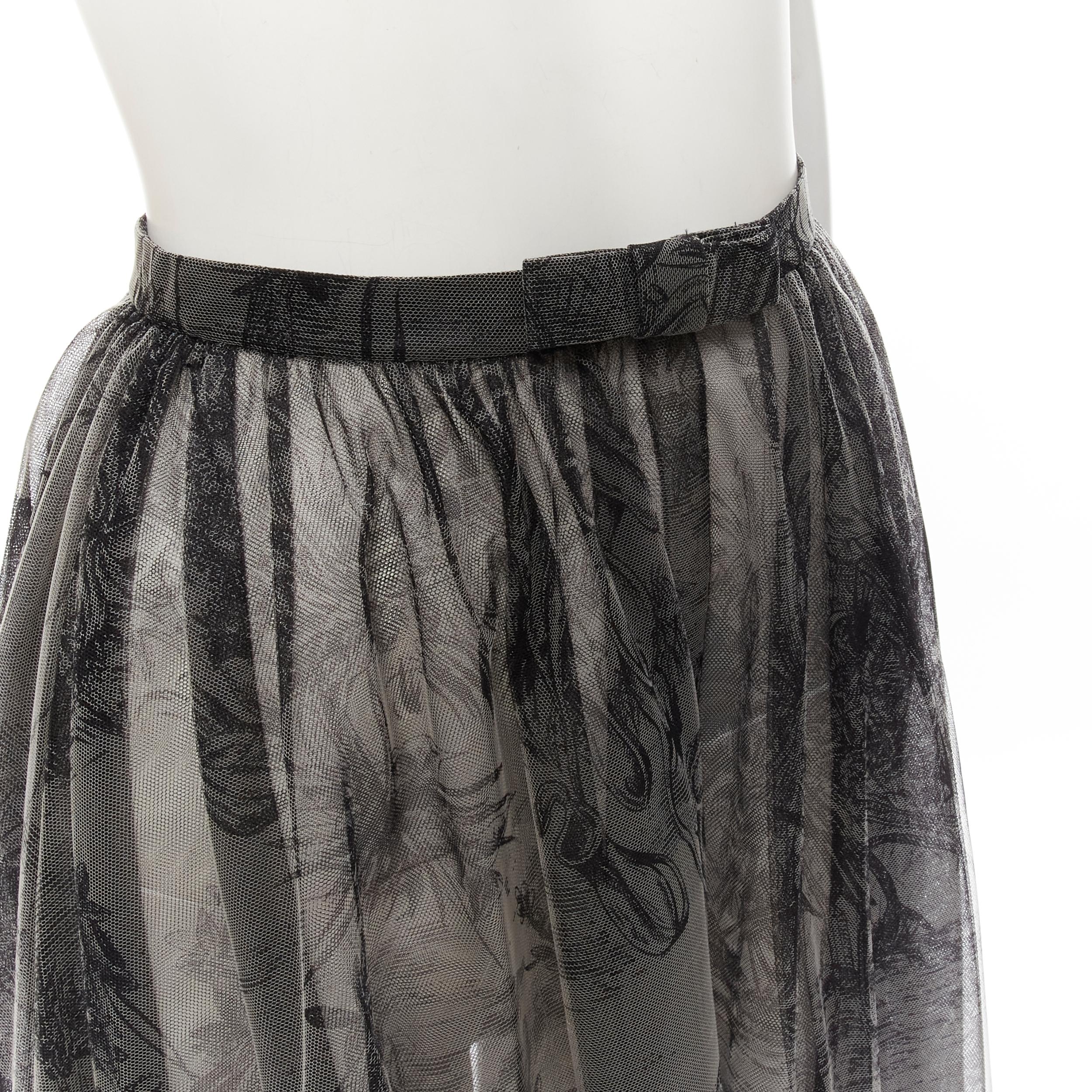 new CHRISTIAN DIOR Fantaisie sheer tulle bow waist open front slit skirt FR34 XS
Brand: Christian Dior
Designer: Maria Grazia Chiuri
Collection: Fantaisie 
Material: Polyamide
Color: Grey
Pattern: Graphic
Closure: Snap Buttons
Extra Detail: Bow
