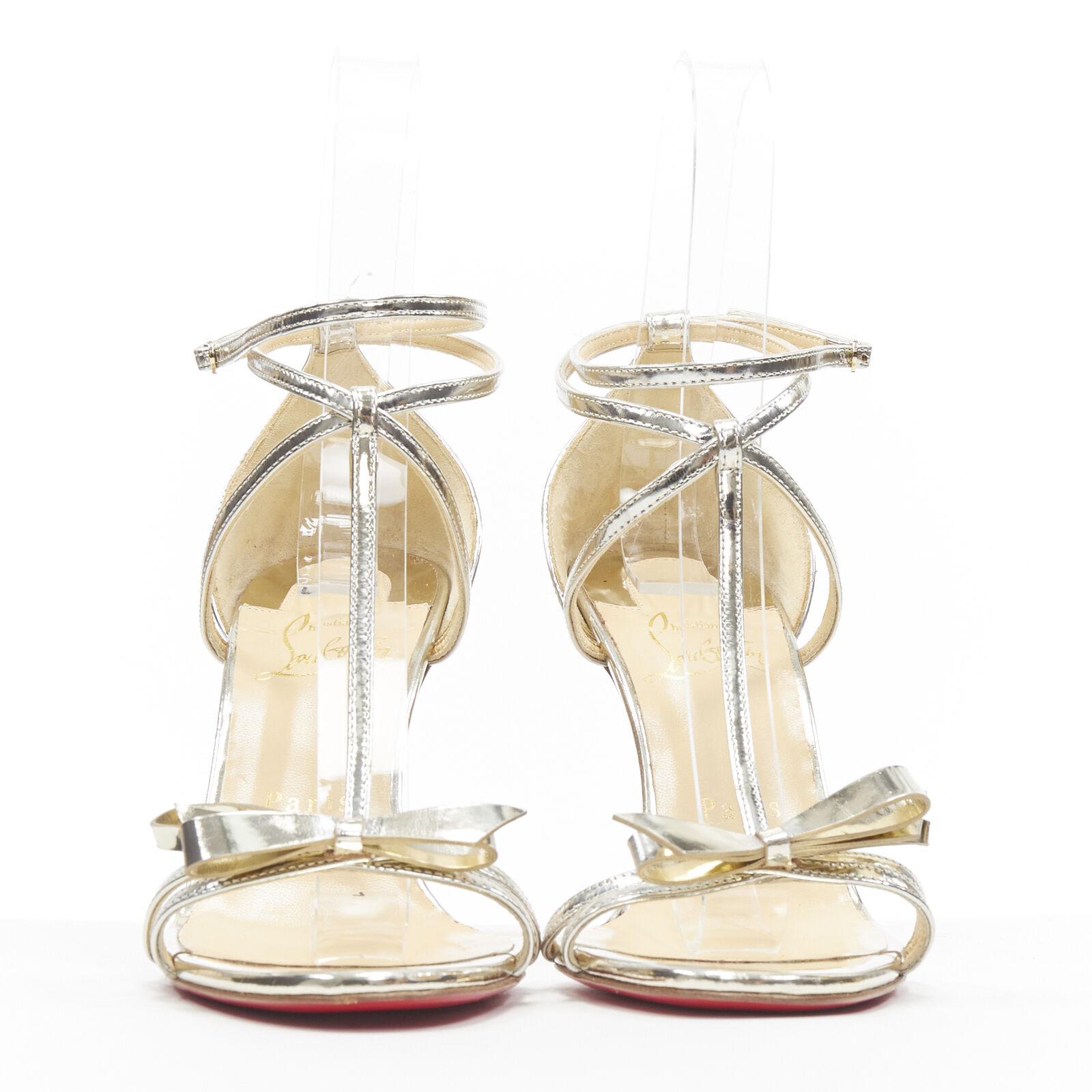 Beige new CHRISTIAN LOUBOUTIN Blakissima metallic silver bow t-strap sandals EU37.5 For Sale