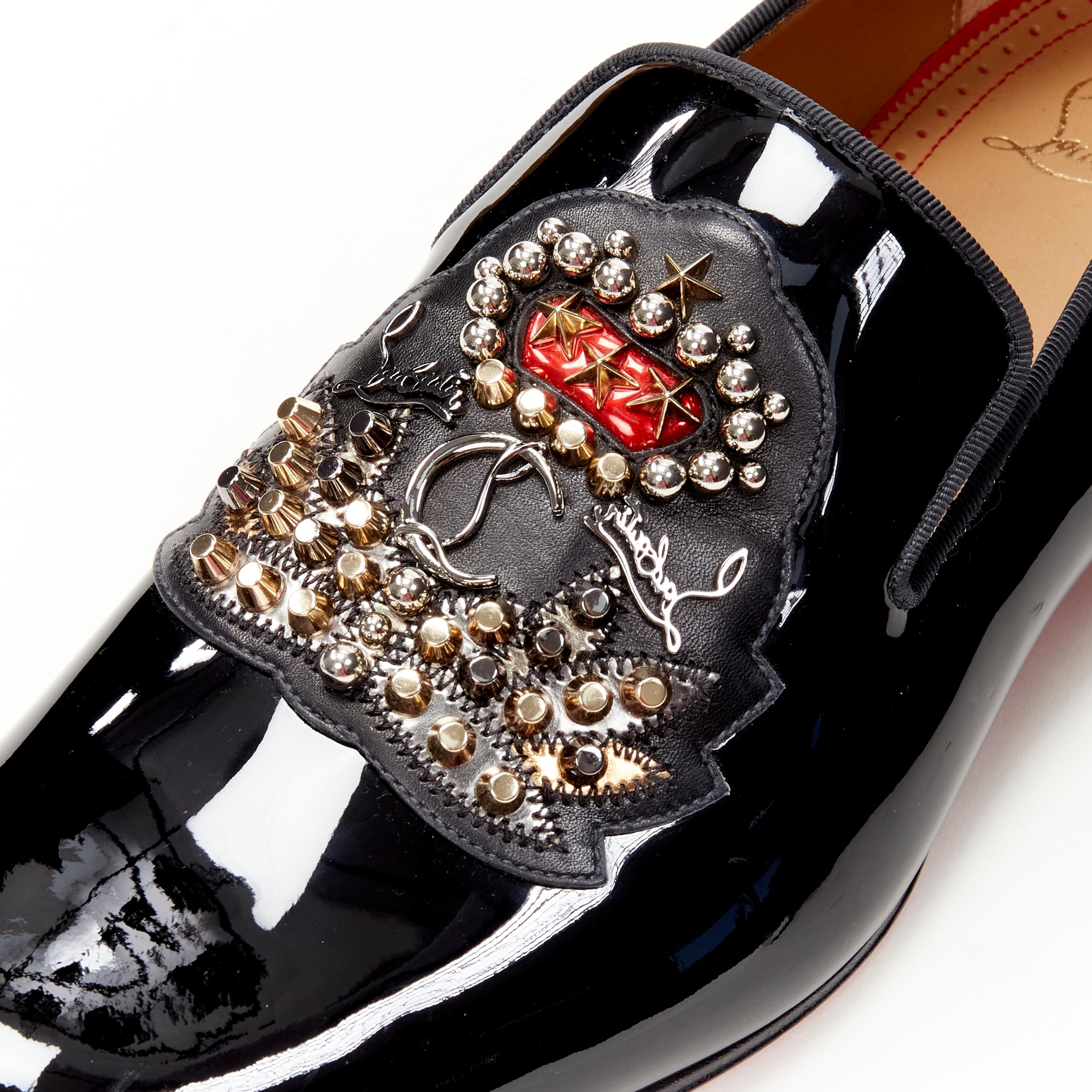 new CHRISTIAN LOUBOUTIN Ecupump Flat black patent CL crest studded loafer EU42 
Reference: TGAS/C01128 
Brand: Christian Louboutin 
Designer: Christian Louboutin 
Model: Ecupump 
Material: Patent Leather 
Color: Black 
Pattern: Solid 
Extra Detail: