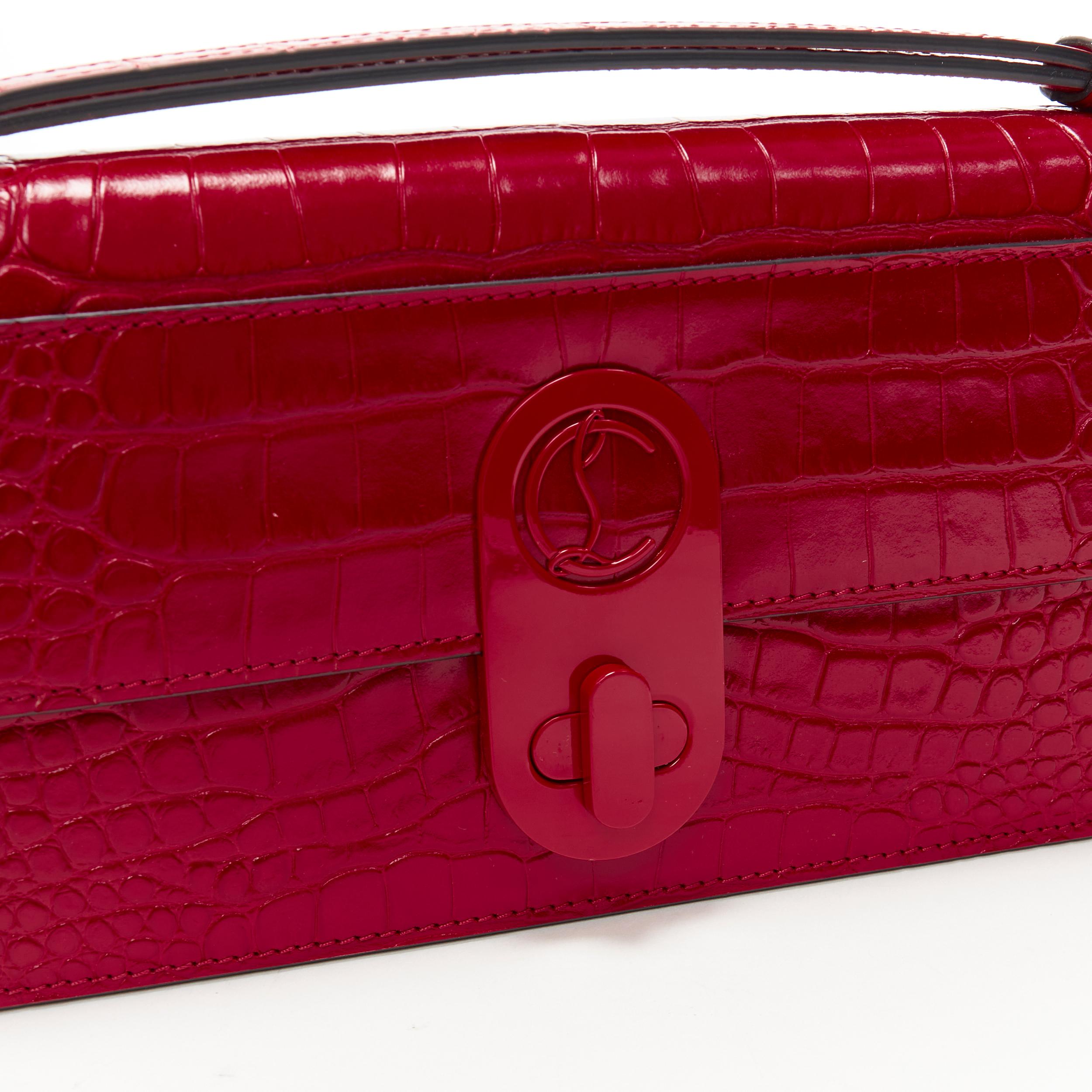 new CHRISTIAN LOUBOUTIN Elisa Baguetta stamped croc calf leather clutch bag Reference: MAWG/A00056 
Brand: Christian Louboutin 
Designer: Christian Louboutin 
Model: Elisa Baguette 
Material: Leather 
Color: Red 
Pattern: Solid 
Closure: Turnlock