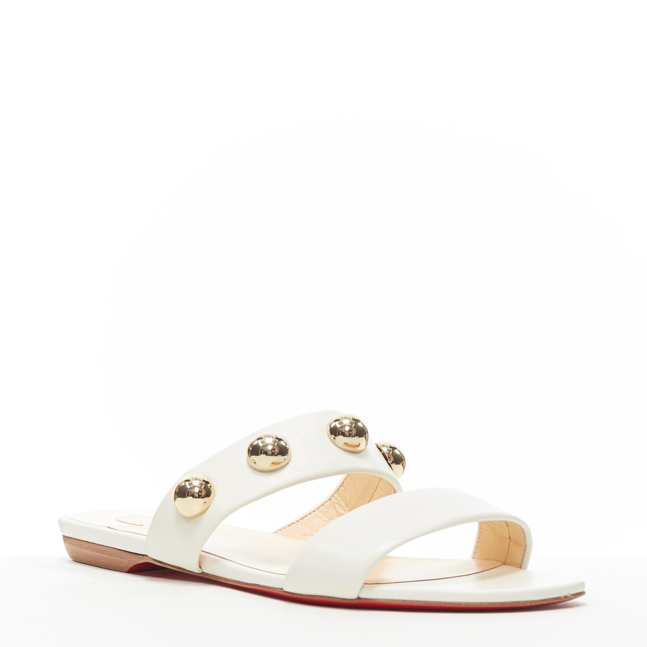 new CHRISTIAN LOUBOUTIN gold dome sphere stud white leather flat sandals EU37.5 
Reference: TGAS/B00747 
Brand: Christian Louboutin 
Designer: Christian Louboutin 
Model: White leather stud sandals 
Material: Leather 
Color: White 
Pattern: Solid