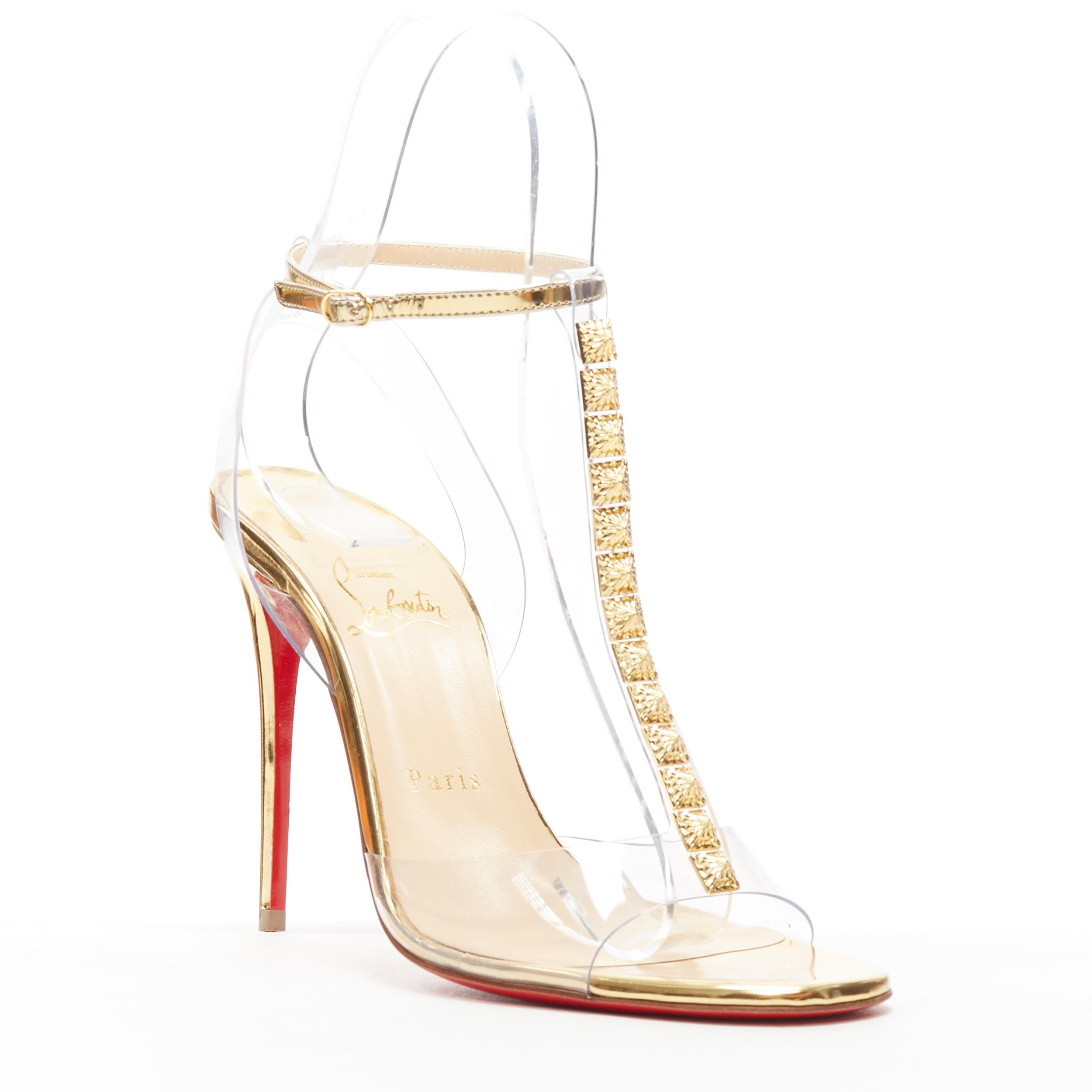 new CHRISTIAN LOUBOUTIN Jamais Assez 100 gold studded PVC T-strap sandals EU38
Brand: Christian Louboutin
Designer: Christian Louboutin
Model Name / Style: Jamais Assez 100
Material: PVC
Color: Gold
Pattern: Solid
Closure: Buckle
Extra Detail: Style