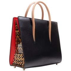 CHRISTIAN LOUBOUTIN Paloma sac cartable moyen clouté en verni léopard noir