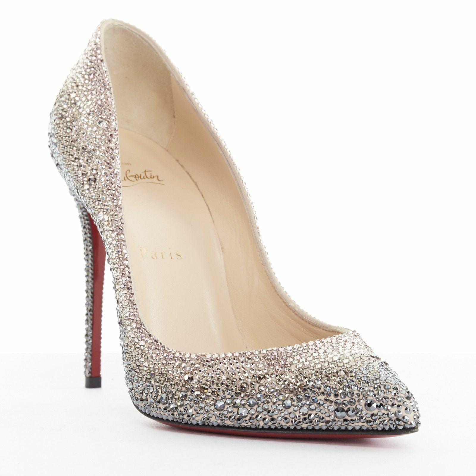 CHRISTIAN LOUBOUTIN
Follies Strass 100 Degrade. Nude suede upper. Fully embellished in strass crystals. Gradient from grey as base to nude to pink. Pointed toe. Tan leather lining. Lighly padded insole. Signature Christian Louboutin red lacquered