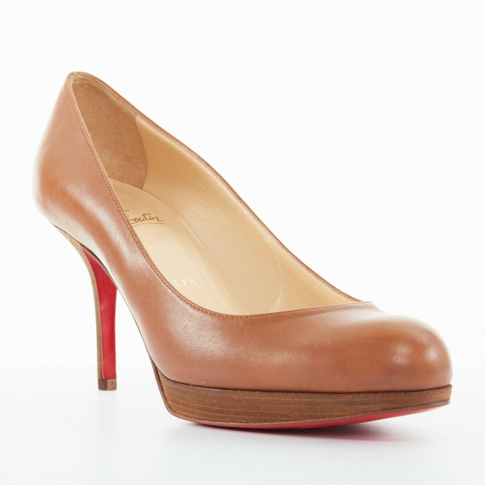 new CHRISTIAN LOUBOUTIN Prorata 90 Wood brown round toe platform heels 37.5
CHRISTIAN LOUBOUTIN
Prorata. 
Brown leather upper. 
Natural wooden platform and heel. 
Round toe. 
Tonal stitching. 
Signature Christian Louboutin red lacquared leather
