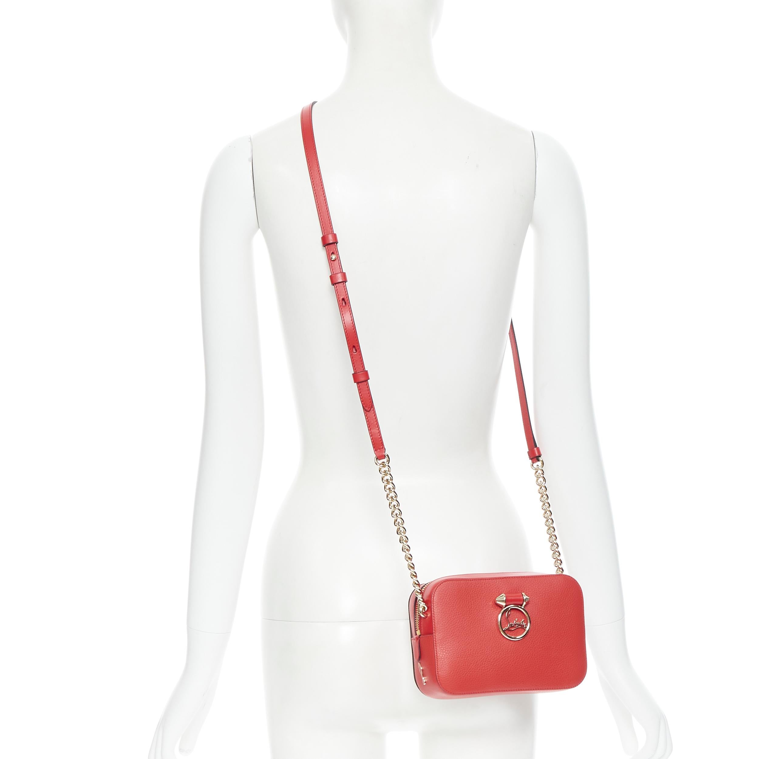 new CHRISTIAN LOUBOUTIN Rubylou Mini red calf leather logo crossbody camera bag 
Reference: TGAS/B00239 
Brand: Christian Louboutin 
Designer: Christian Louboutin 
Model: Rubylou Mini 
Material: Leather 
Color: Red 
Pattern: Solid 
Closure: Zip
