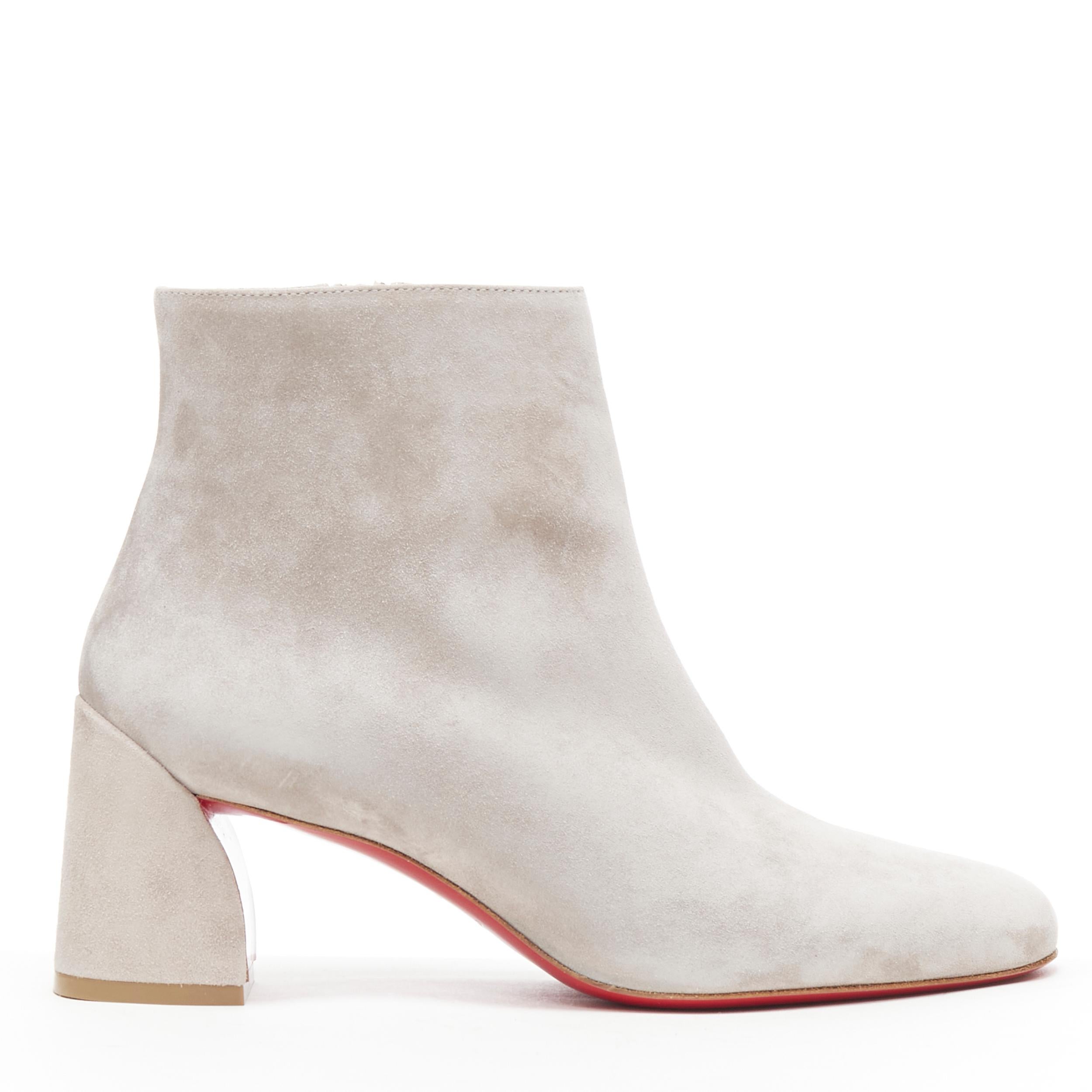 new CHRISTIAN LOUBOUTIN Turela 55 grey suede curved chunky heel bootie EU38 Reference: TGAS/B00258 
Brand: Christian Louboutin 
Designer: Christian Louboutin 
Material: Suede 
Color: Grey 
Pattern: Solid 
Closure: Zip 
Extra Detail: Turela 55. Grey