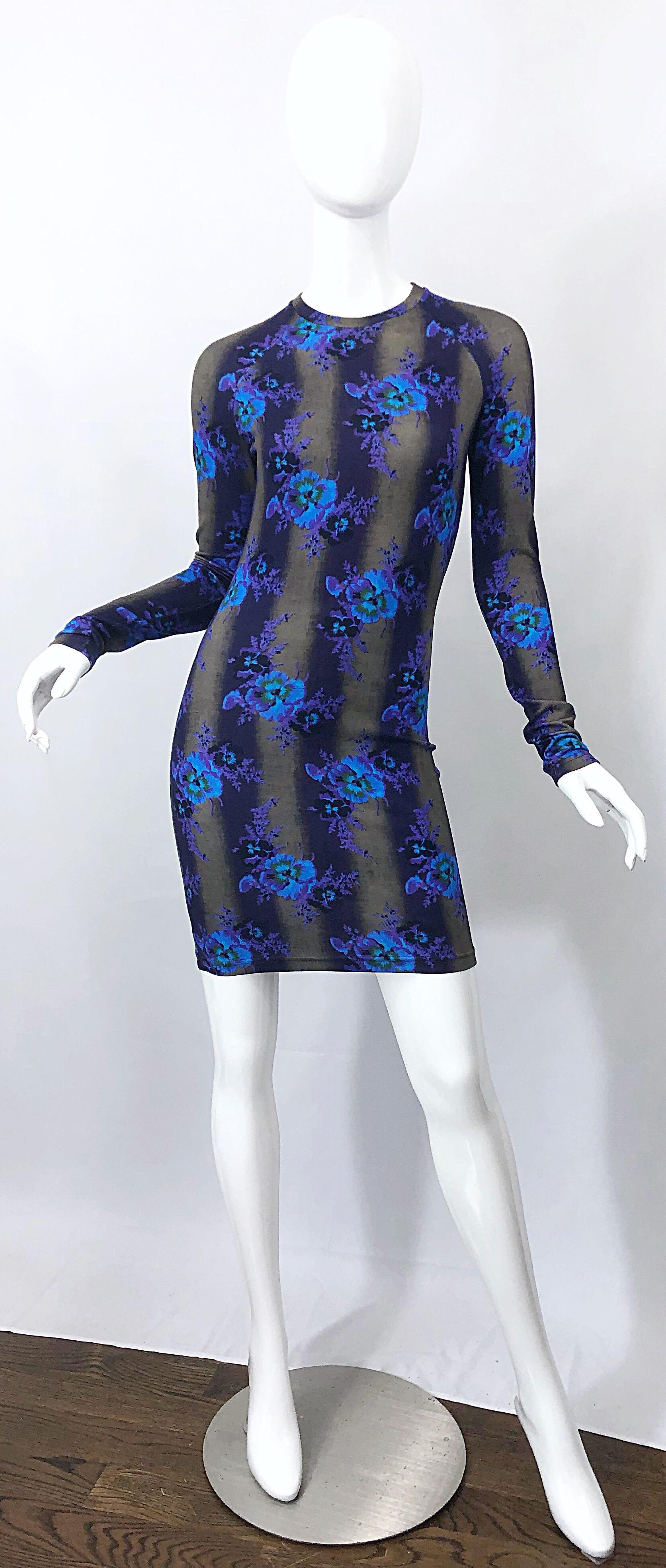 New CHRISTOPHER KANE long sleeve bodycon flower / striped print dress! Features a grey / brown background with dark purple vertical stripes. Vibrant colored flowers in purple, blue and green printed throughout. Soft viscose (94%) and elastane (6%)