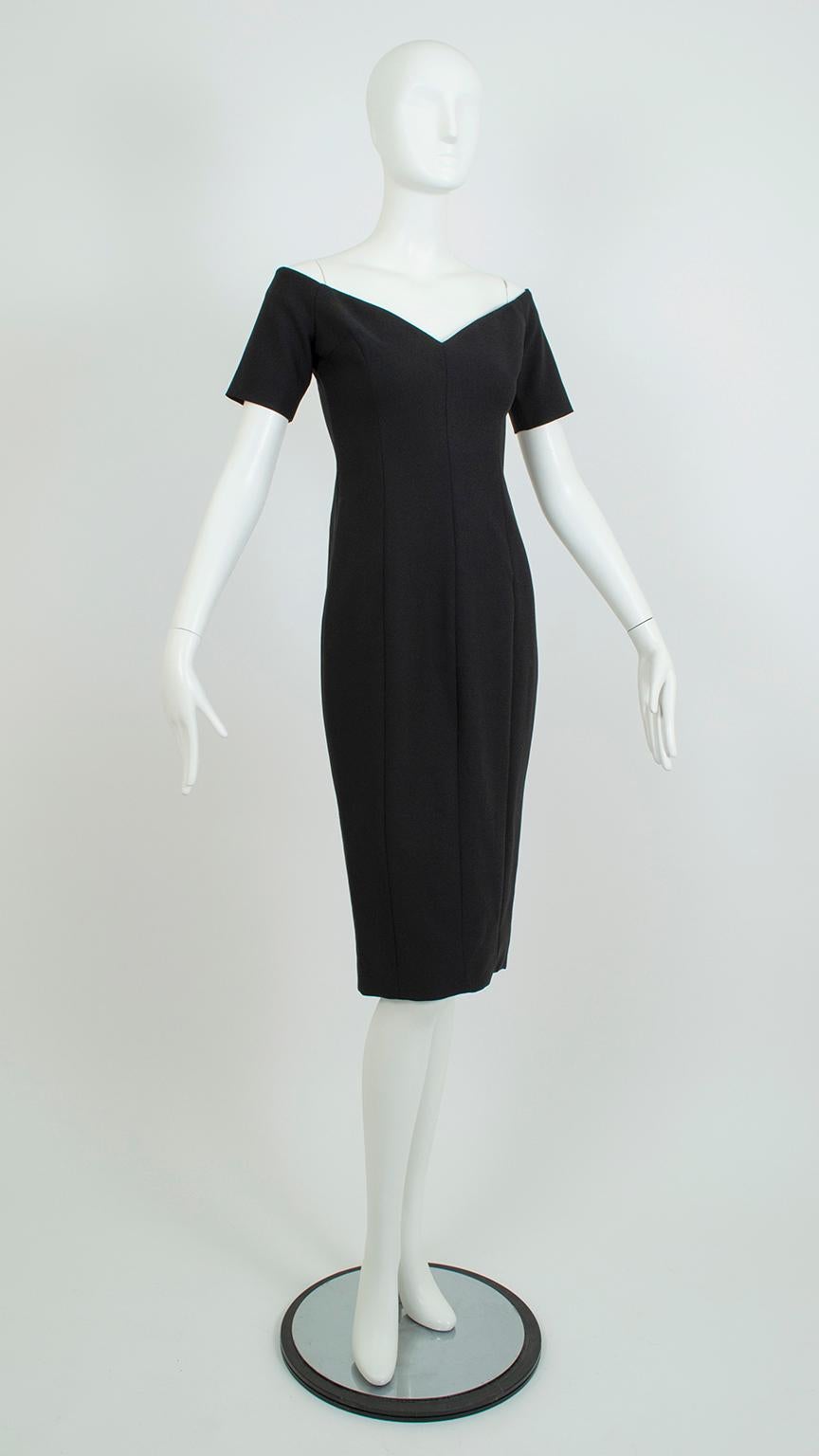 A true bombshell dress, this svelte little number remains devastatingly sexy while maintaining full modesty. A perfect facsimile of an early 60s hourglass cocktail dress, it features a wide off-shoulder portrait neckline, pulled-in waist and