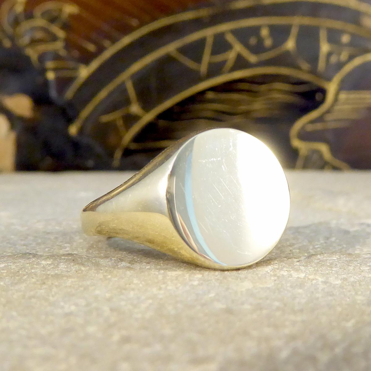 The signet ring is a classic and staple addition to any mans finger. It has become a universal unisex ring now and most commonly worn on the pinky finger. This ring is new and never worn fully crafted from 9ct Yellow Gold with a plain circular face