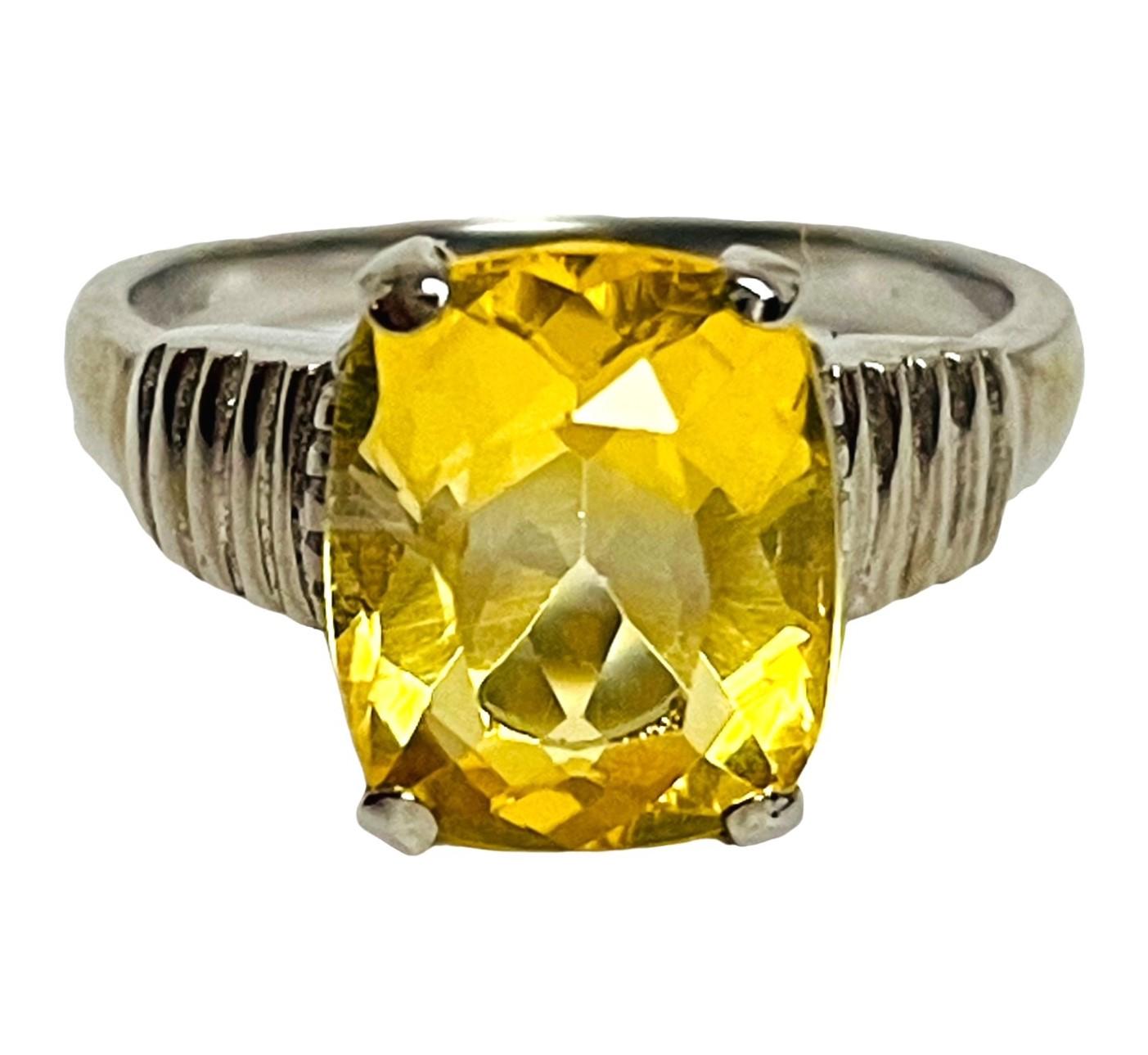 The stone is natural and has not been enhanced in any way.  Beautiful statement ring for sure.  The stone s 10.78 x 8.7 mm. The stone is 3.4 carats.  The ring itself is 13.78 ctw.   Total weight in grams is 2.85 grams.  It will be sure to get