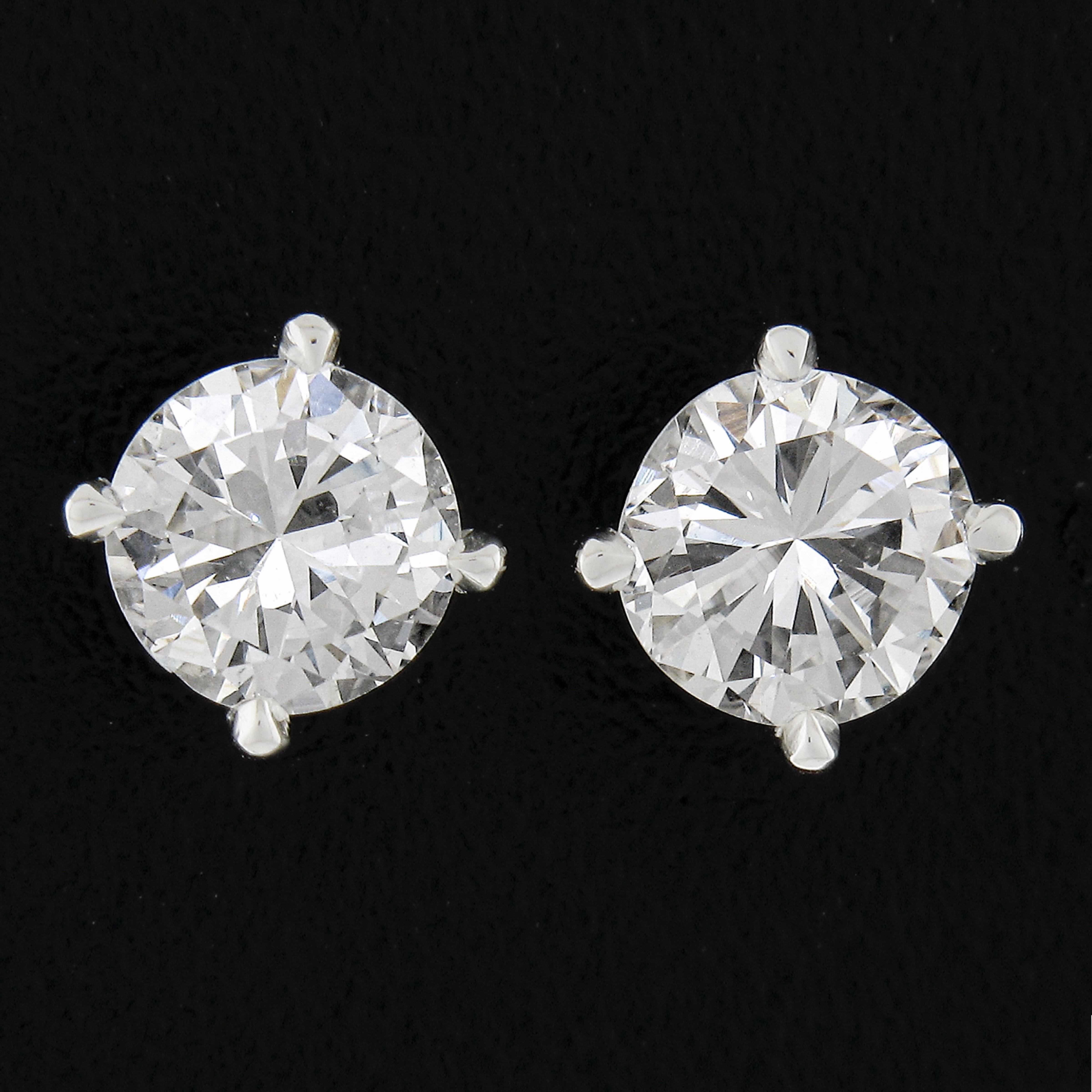 Here we have a brand new classic pair of stud earrings. They feature a pair of genuine natural diamonds with a round brilliant cut that together total exactly 0.80 carats in weight. You will find yourself wearing these studs every day, comfortably