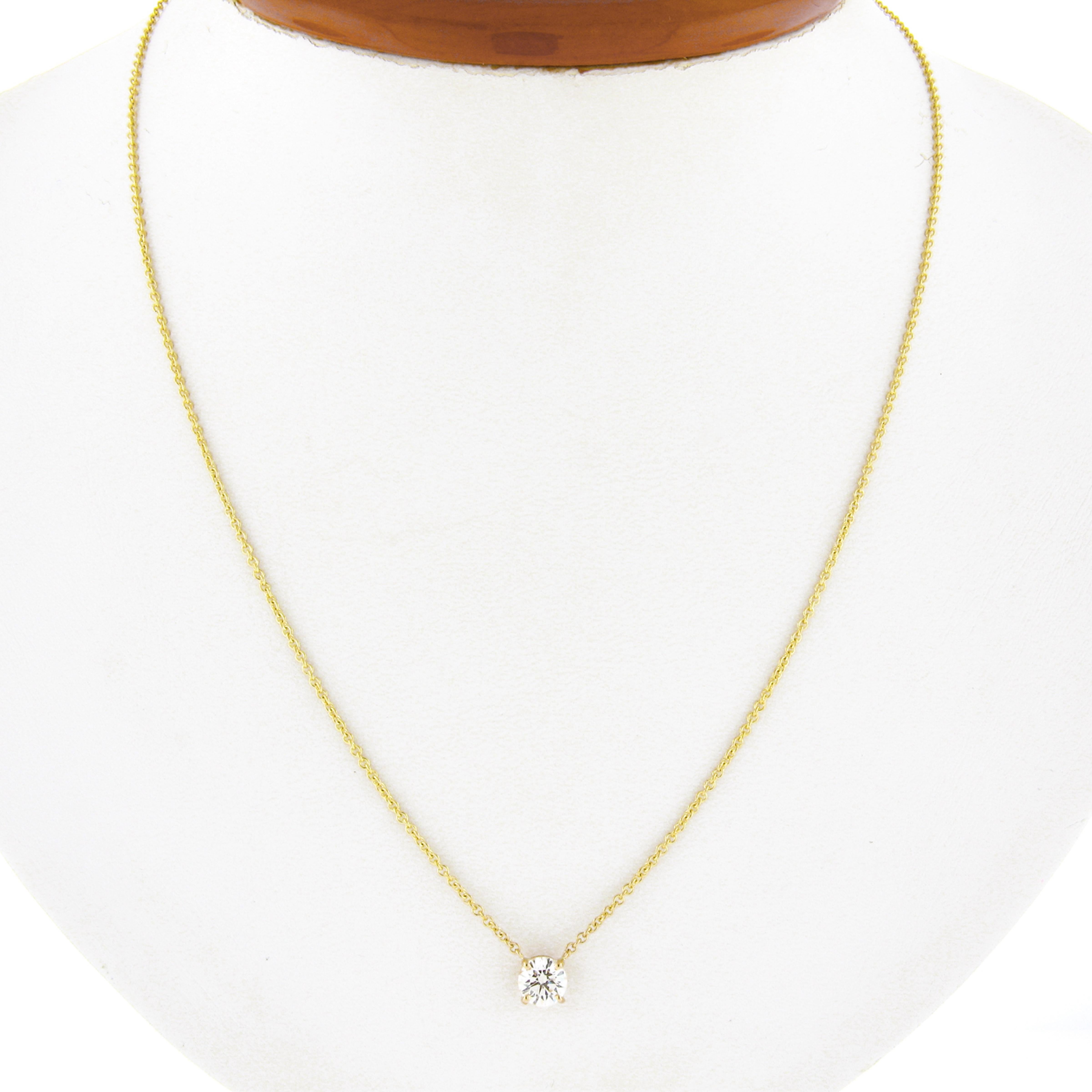 You are looking at a simple and classically styled diamond solitaire pendant that is newly crafted in solid 14k yellow gold. The round brilliant cut diamond on this pendant is neatly prong set in an open basket and weighs exactly 0.58 carats,