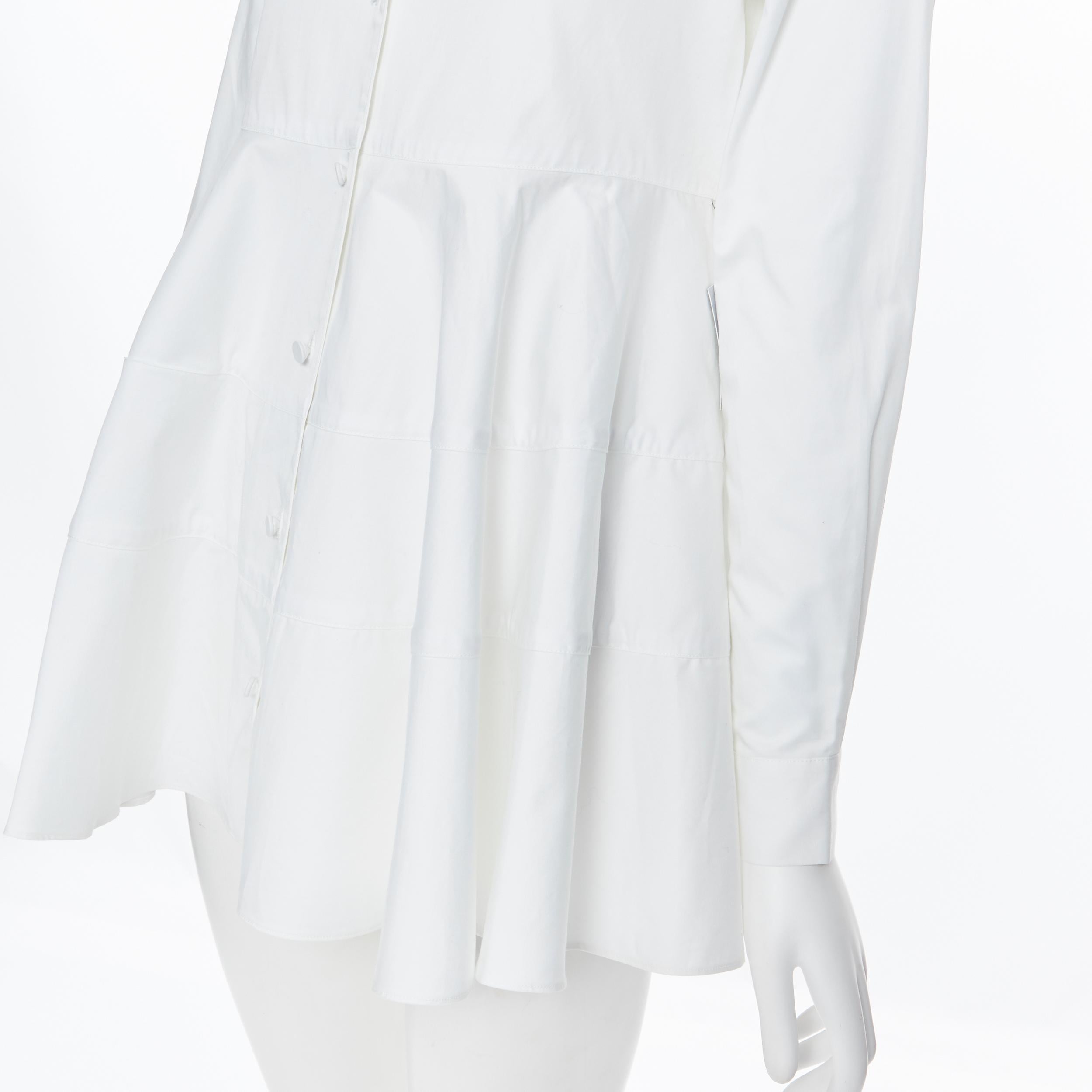 new CO COLLECTION ESSENTIALS white cotton tiered flared hem shirt top  XS
Brand: Co Collection
Model Name / Style: Flared shirt
Material: Cotton
Color: White
Pattern: Solid
Closure: Button
Extra Detail: Tiered flared hem. Tunic shirt Collared