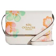 Coach - Mini sac à bandoulière en cuir blanc à imprimé floral « Brynn Dreamy Land », état neuf