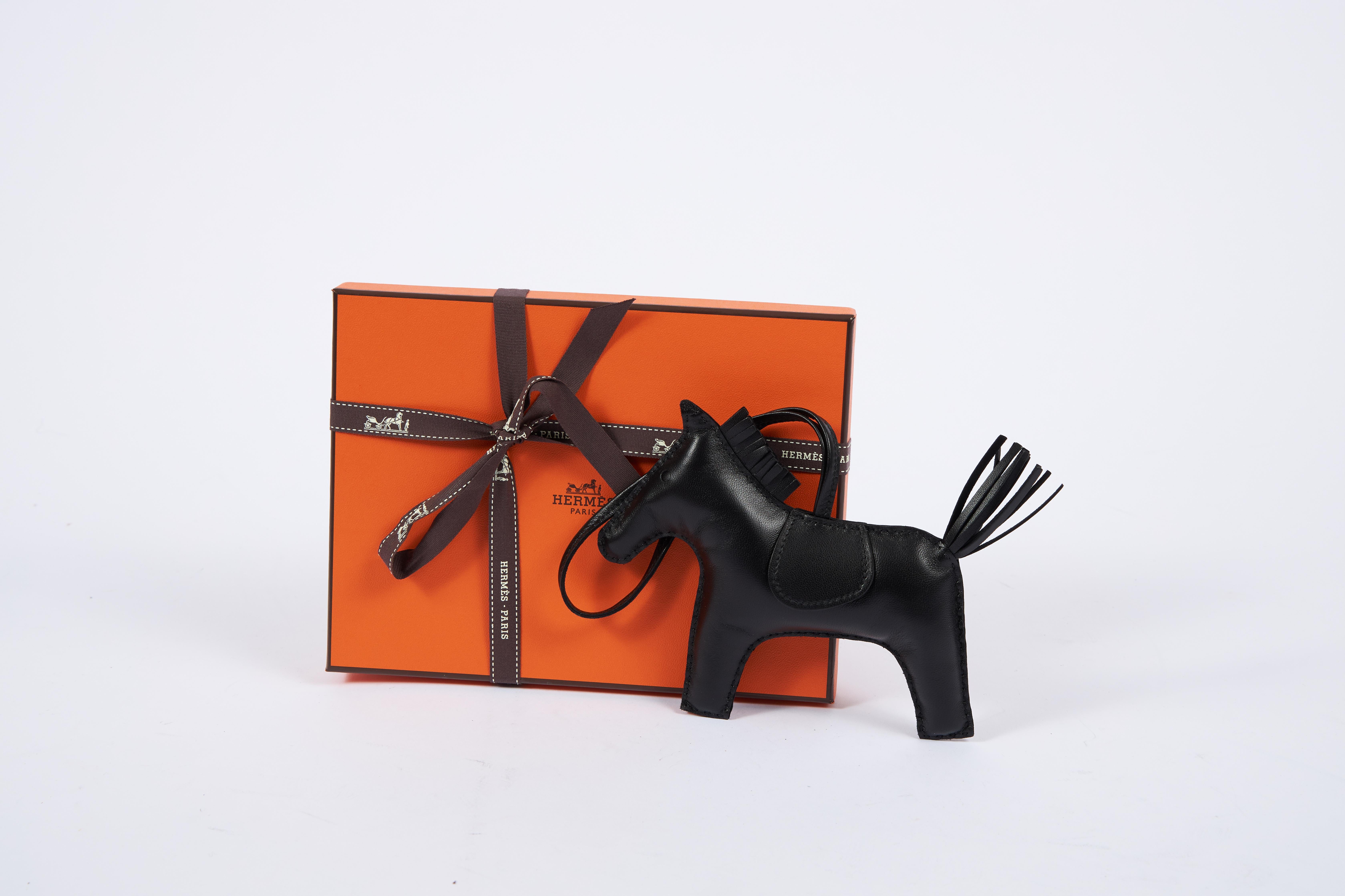 Hermes rare and collectible brand new in box large grigri roder all black swift leather charm. Comes with original box, ribbon and shopping bag.
