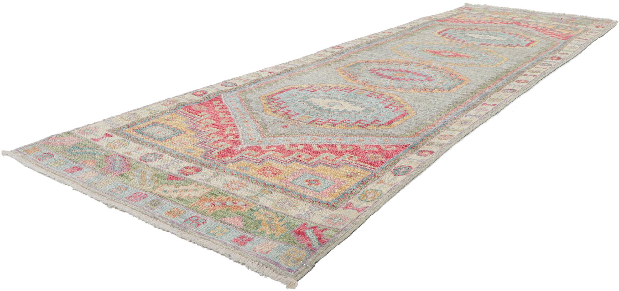 80969 New Colorful Oushak Runner 02'10 x 09'04.
​Polished and playful with a hint of nomadic charm, this hand-knotted wool contemporary Oushak runner beautifully embodies a modern style. The abrashed field features hooked medallions decorated with