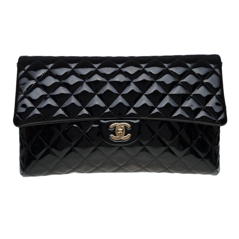 New Condition- Chanel Clutch in black patent quilted leather, Champagne  hardware at 1stDibs