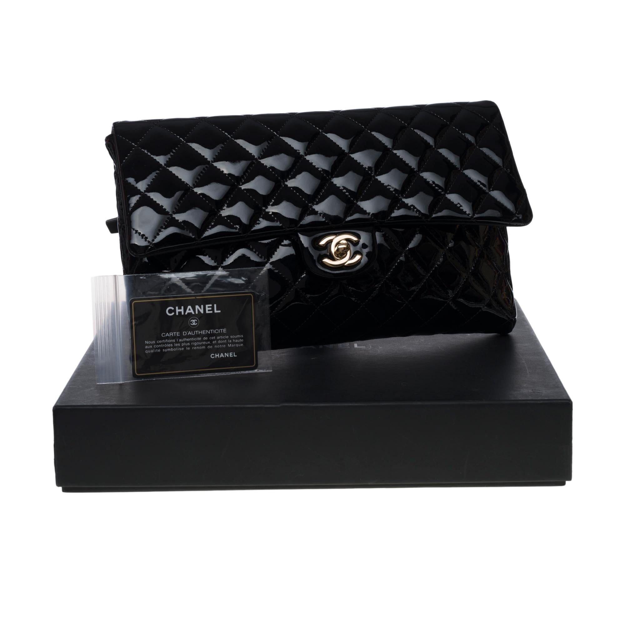 New Condition- Chanel Clutch in black patent quilted leather, Champagne hardware 1
