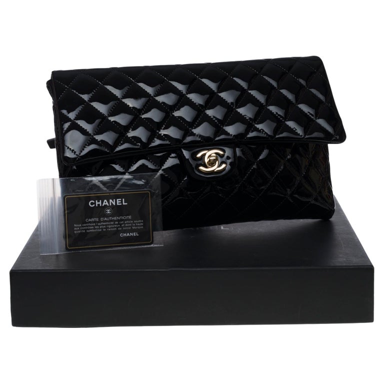 New Condition- Chanel in black patent leather, Champagne hardware For Sale at 1stDibs