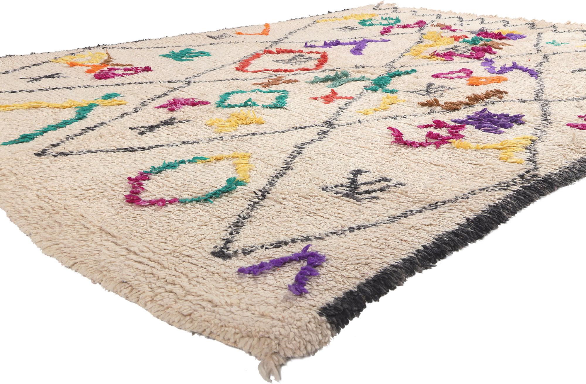21031 Colorful Moroccan Azilal Rug, 06'03 x 09'01. Enter the enchanting world of Moroccan artistry through our meticulously hand-knotted wool Azilal rug—an exquisite piece that transcends the boundaries of mere decor. Crafted by skilled artisans,
