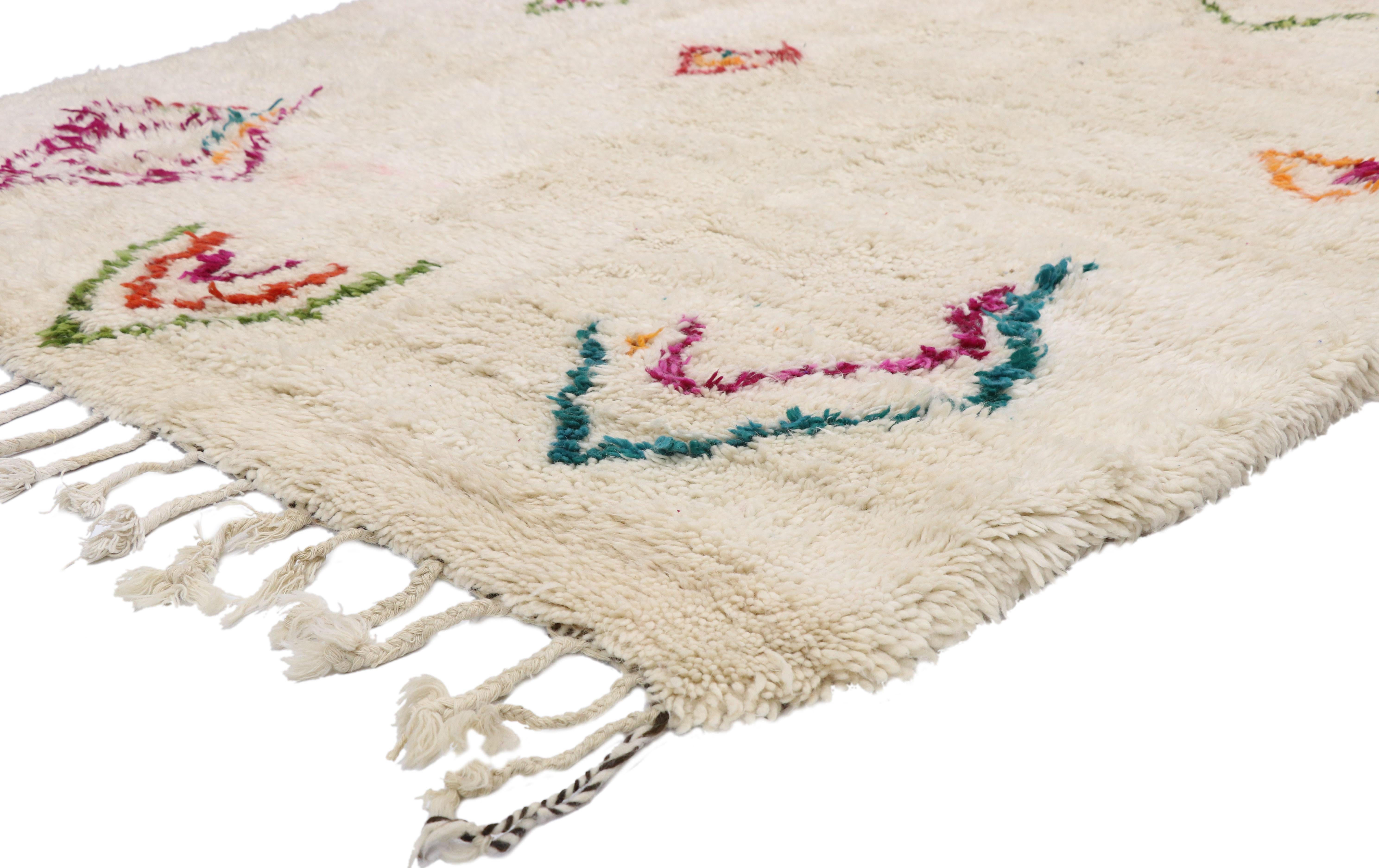 21039, new contemporary Berber Moroccan Azilal rug with Cozy Hygge boho tribal vibes. This hand knotted wool contemporary Berber Moroccan Azilal rug features colorful tribal motifs spread across the creamy-beige backdrop. The ambiguous tribal