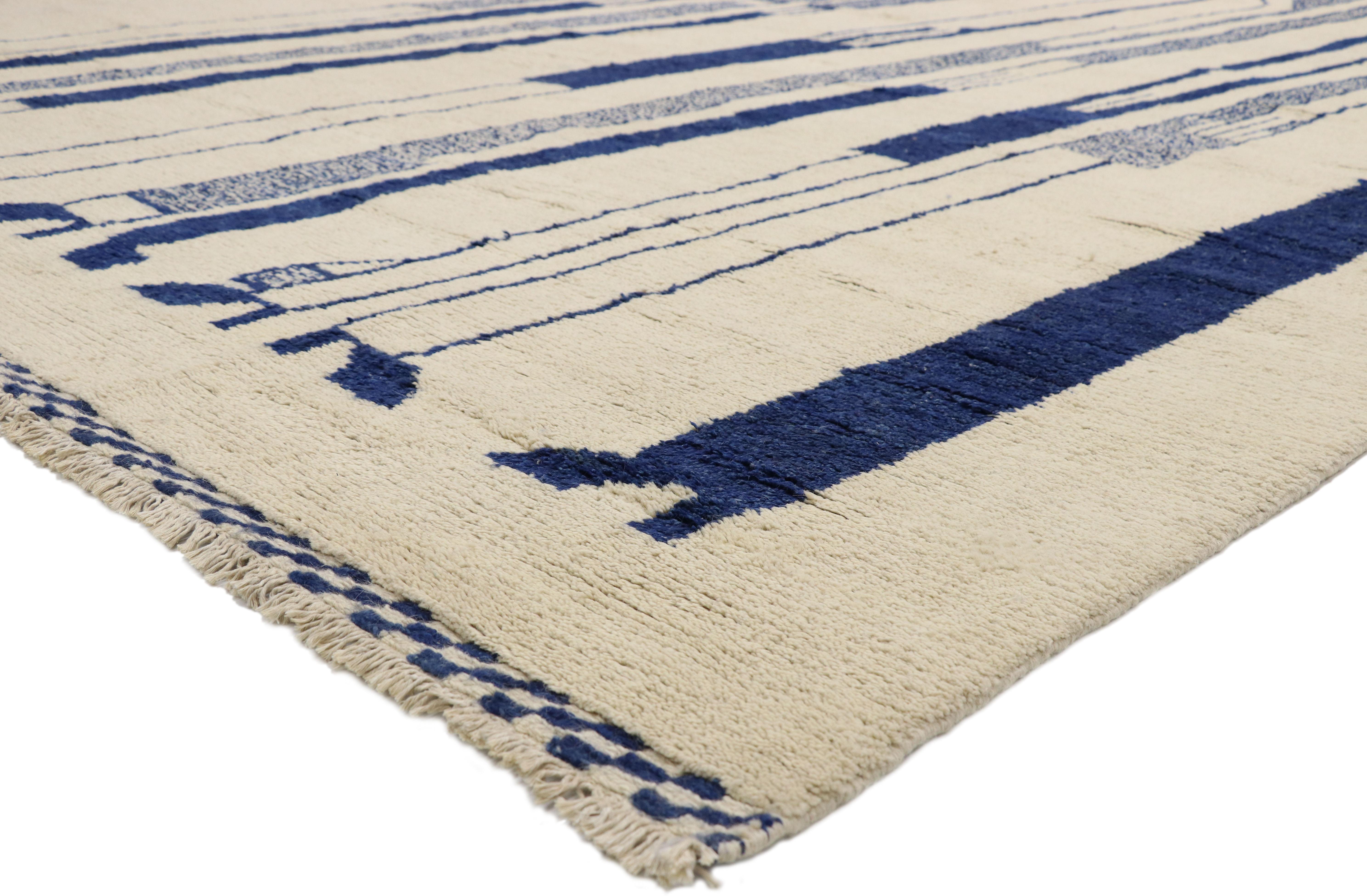 80532, new contemporary Moroccan rug Inspired by Alberto Giacometti Dogon Tribe. This hand knotted wool contemporary Moroccan style area rug features elongated silhouettes in a blue-scale palette against a solid creamy-beige backdrop. With cool Jazz