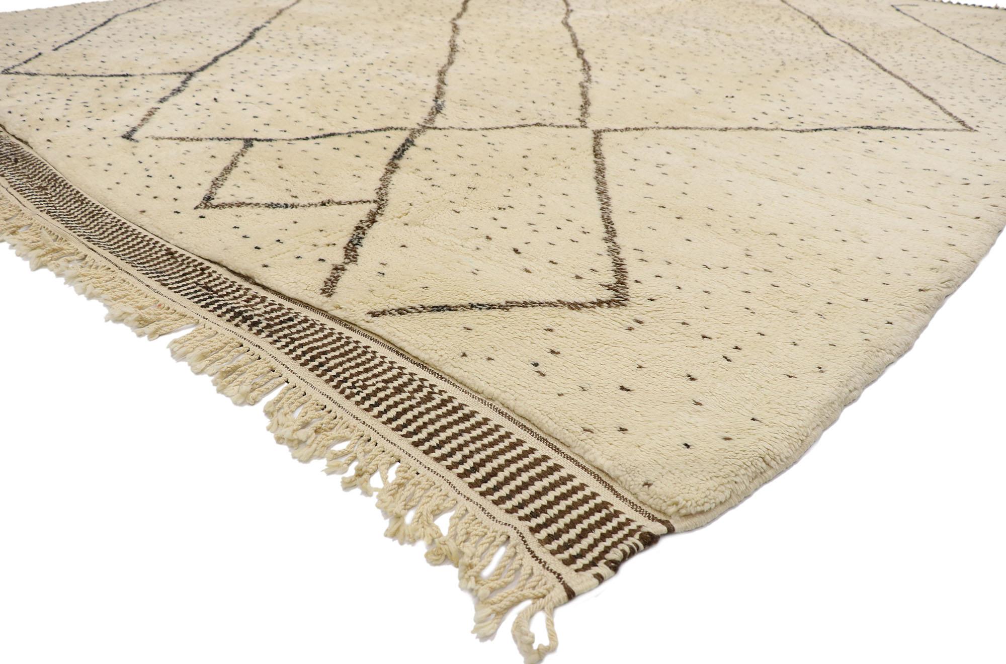 21152 Authentic Berber Moroccan Rug 10'09 x 12'03.
Nomadic charm meets Mid-Century Modern style in this hand knotted wool Berber Moroccan rug. The intrinsic tribal design and neutral colors woven into this piece work together creating a feeling of