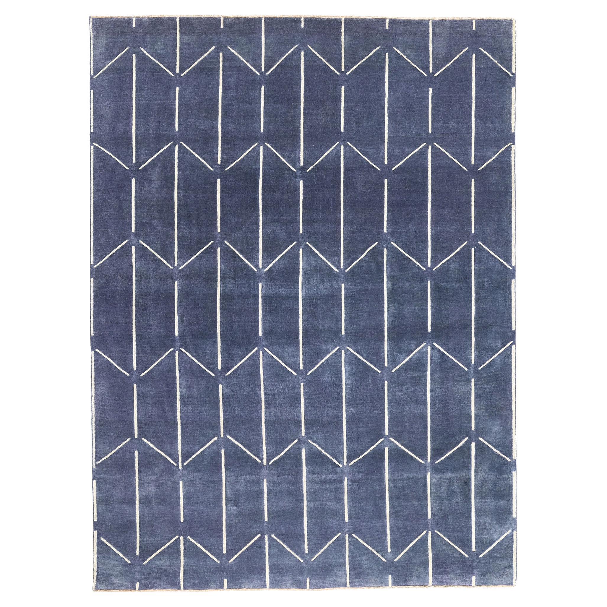 Un nuovo tappeto contemporaneo blu con texture alta e bassa e design rialzato post-moderno.