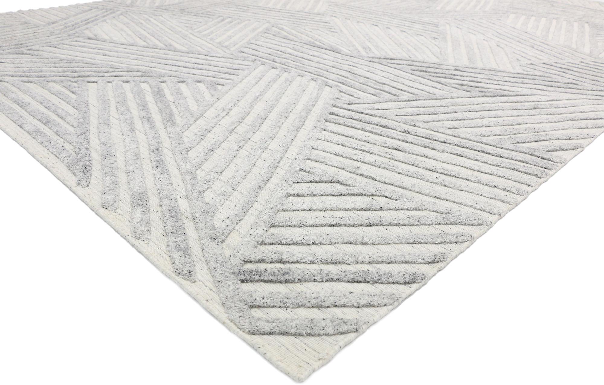 30422 Tapis moderne texturé High-Low 09'00 x 11'10. La sophistication moderne rencontre le zen dans ce tapis haut-bas texturé, créant un mélange harmonieux qui met l'accent sur la simplicité, le minimalisme et la tranquillité. Cette fusion associe