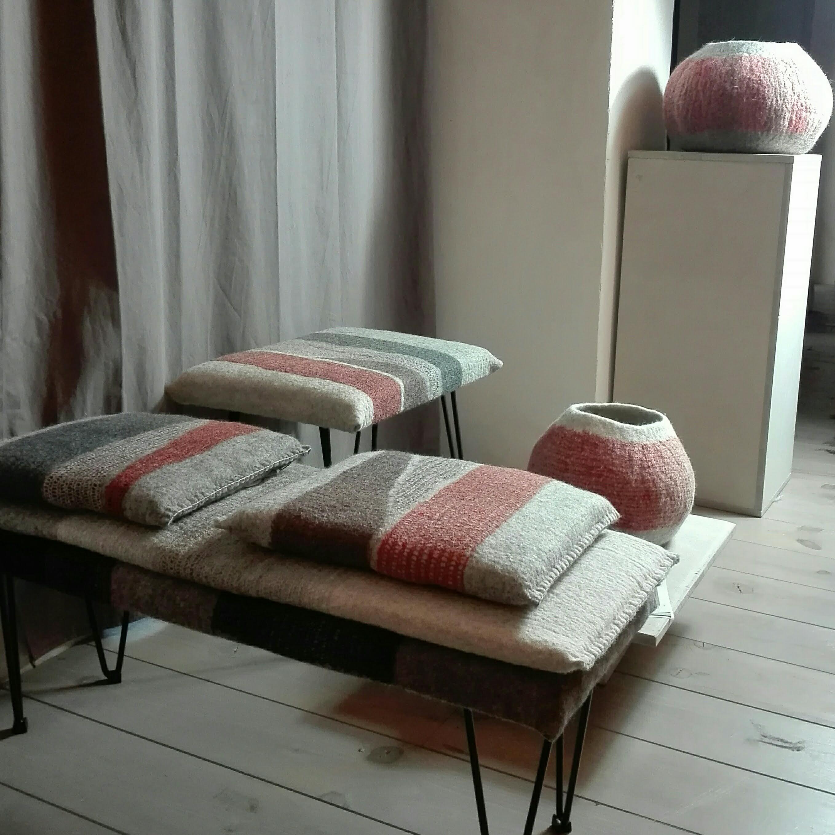 A contemporary wool stool on the cutting edge of design. Textile designer Ghislaine Garcin has invented a new form of material, integrating knitted wool into wool felt to create her magnificent Knitting & Felt stools in earthy shades of rust, brown