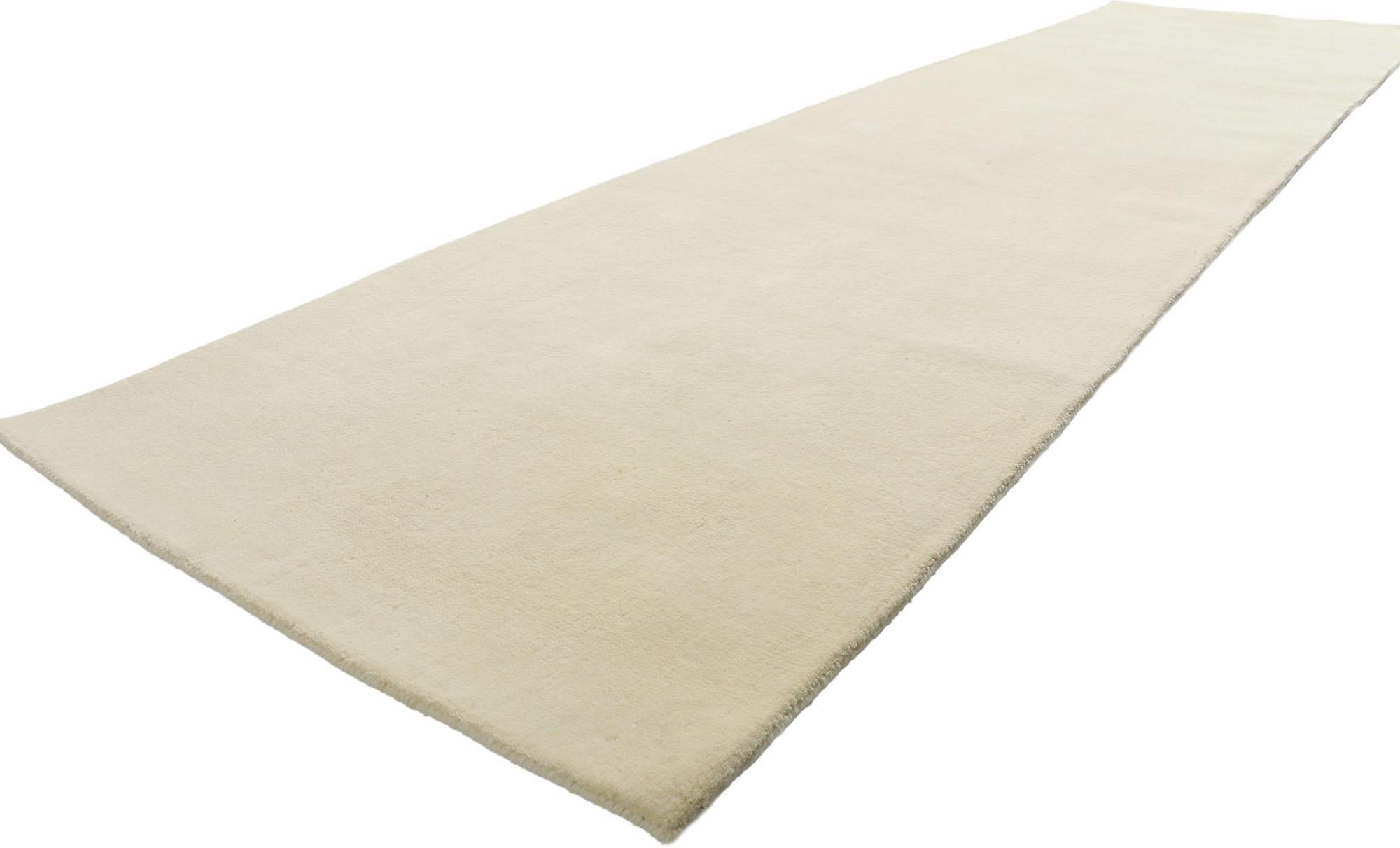 30755 New Contemporary Ivory Rug Runner with Minimalist Style, 03'02 x 11'11. Wrapped in an enchanting world of modern allure and understated minimalism, this hand-loomed wool rug emerges from the skilled looms of contemporary India. Its essence