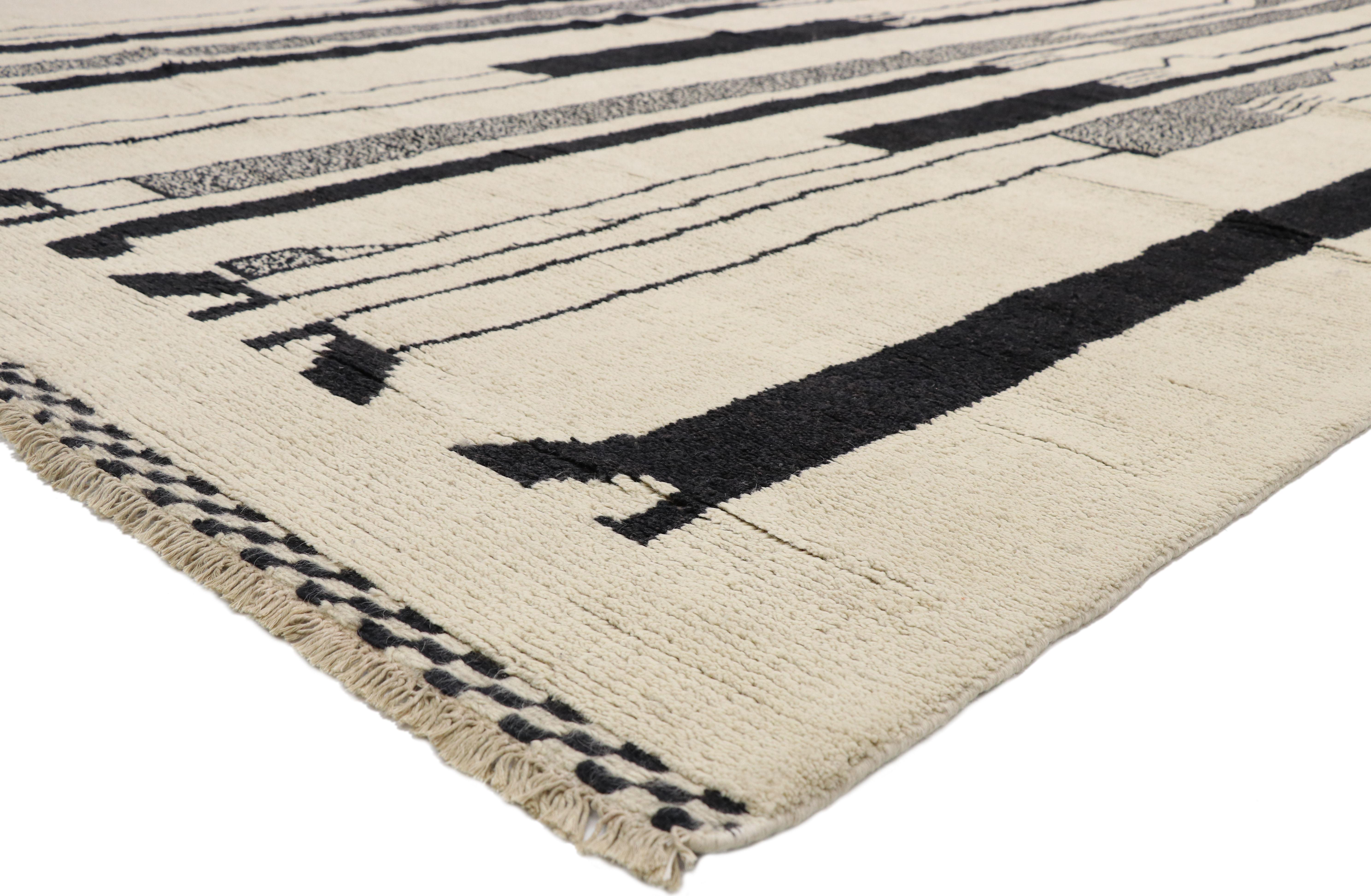 80531, new contemporary Moroccan rug Inspired by Alberto Giacometti Dogon Tribe. This hand knotted wool contemporary Moroccan rug features elongated silhouettes in a black-scale palette against a solid creamy-beige backdrop. With cool Jazz Age style