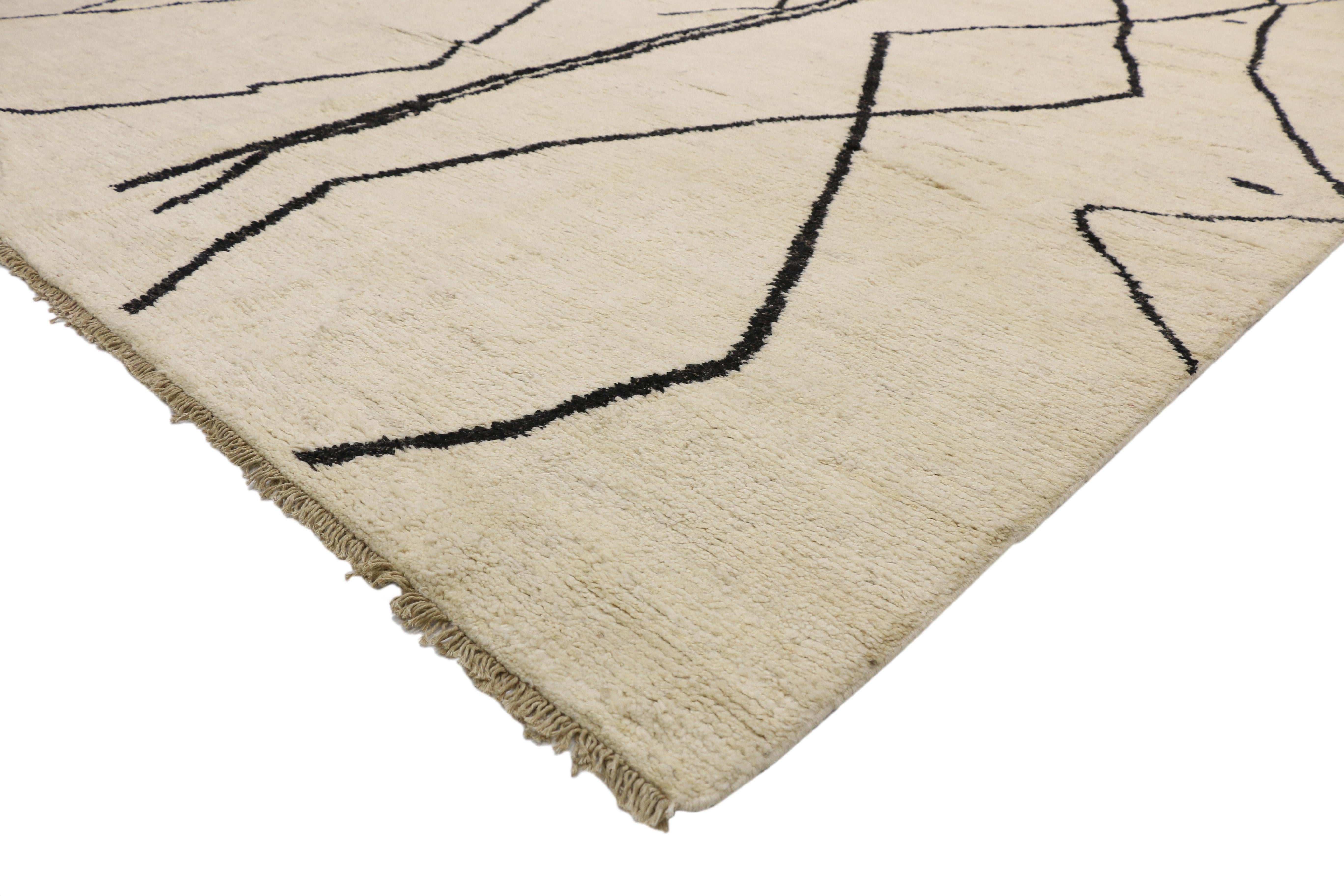 80513 Modern Tribal Moroccan Rug, 10'02 x 13'10. This contemporary Moroccan area rug, meticulously hand-knotted from wool, boasts a striking line art design infused with tribal influences. Against a sandy-beige backdrop, two bold black lines command