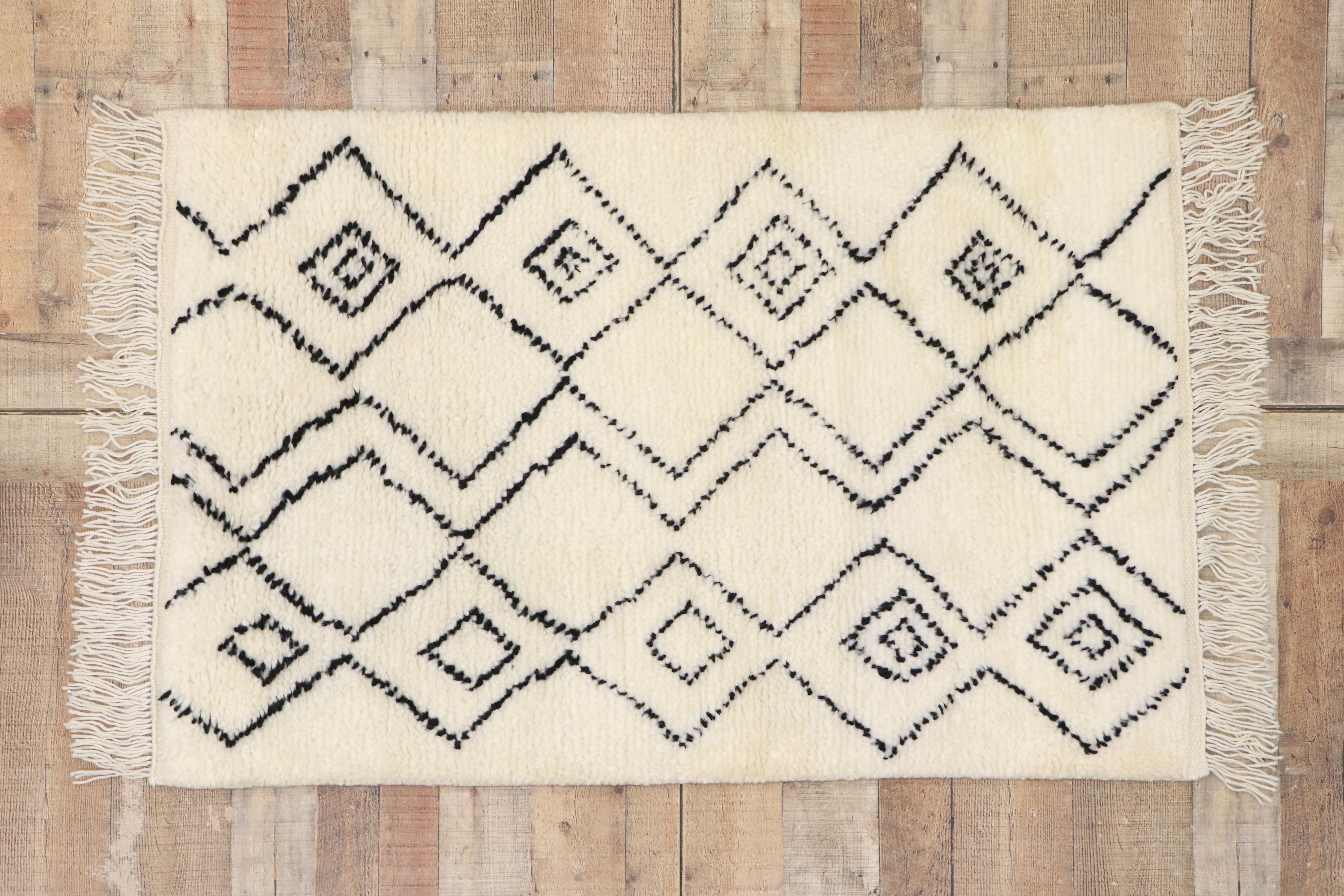 30609 new contemporary Moroccan style rug with Minimalist tribal vibes. This hand knotted wool contemporary Moroccan area rug features offset vertical columns composed of black zigzag chevron lines unite to form stacked lozenges forming a diamond
