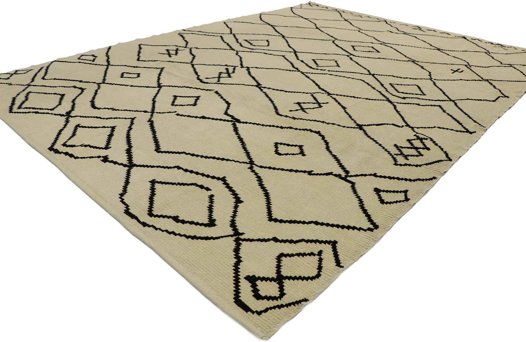 53192, new contemporary Moroccan style rug with tribal design and hygge vibes. Warm and inviting with cozy hygge vibes, this hand knotted wool contemporary Moroccan style rug features contrasting black lines running the length of the sandy-beige