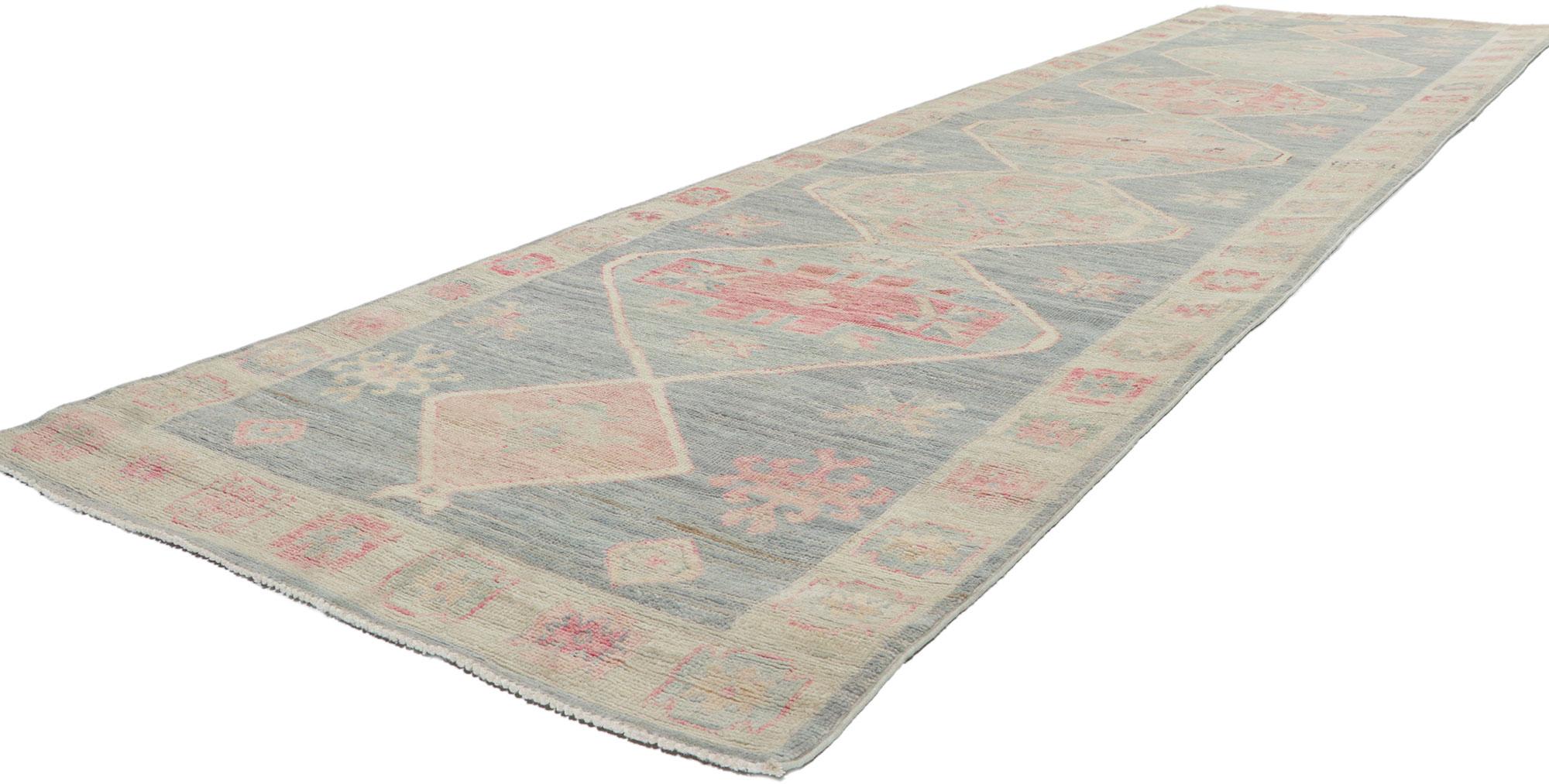 80879 New Vintage-Inspired Oushak Runner with Modern Style, 03'04 x 12'07.
Polished and playful, this hand-knotted wool contemporary Oushak runner beautifully embodies a modern style. The abrashed field features stacked medallions decorated with