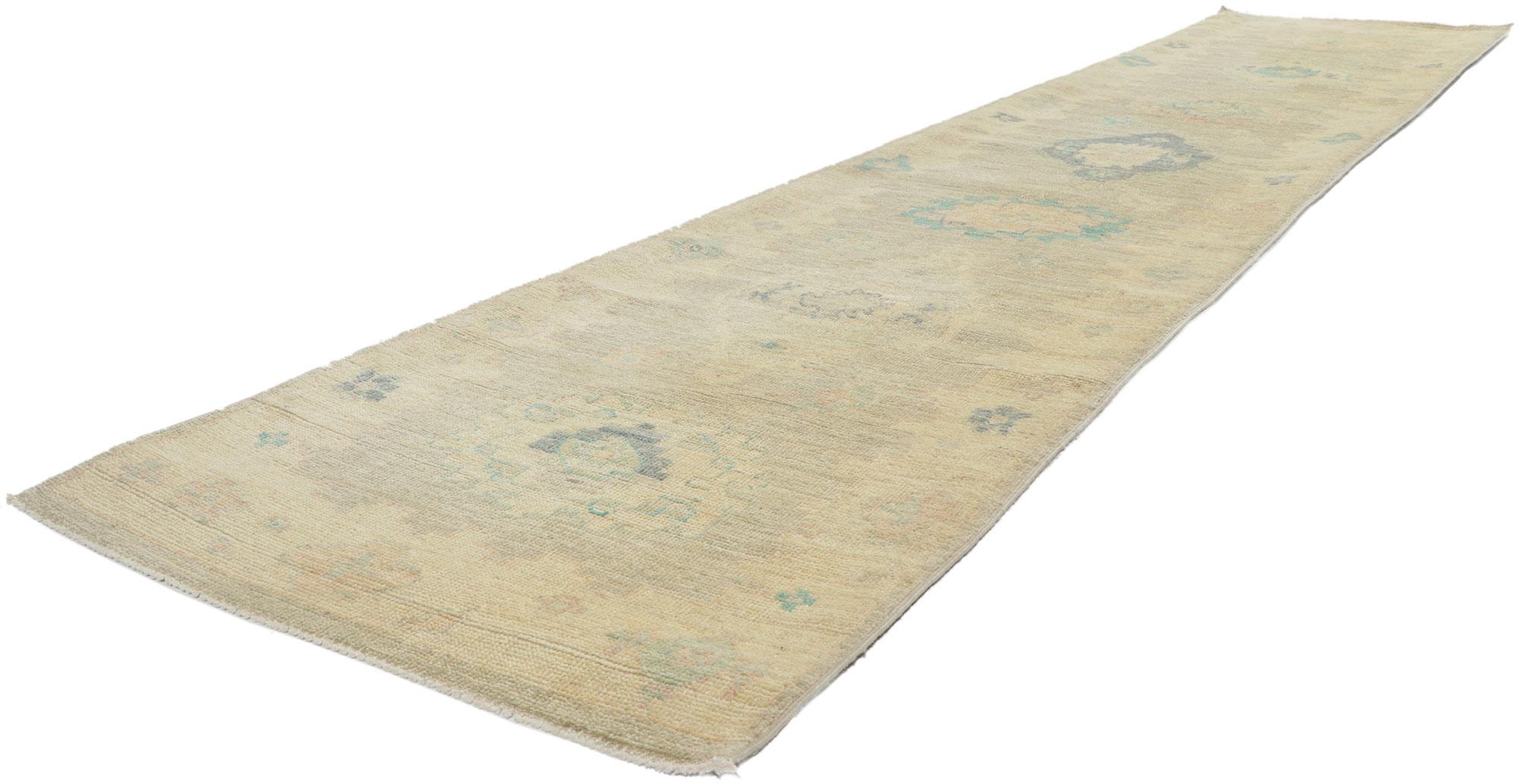 80841 Modern Oushak Rug Runner, 02'05 x 11'10.
Transport yourself into a world of contemporary elegance and tranquil sensibility with this hand knotted wool modern Oushak rug runner. Its nature-inspired design and muted pastel color palette merge