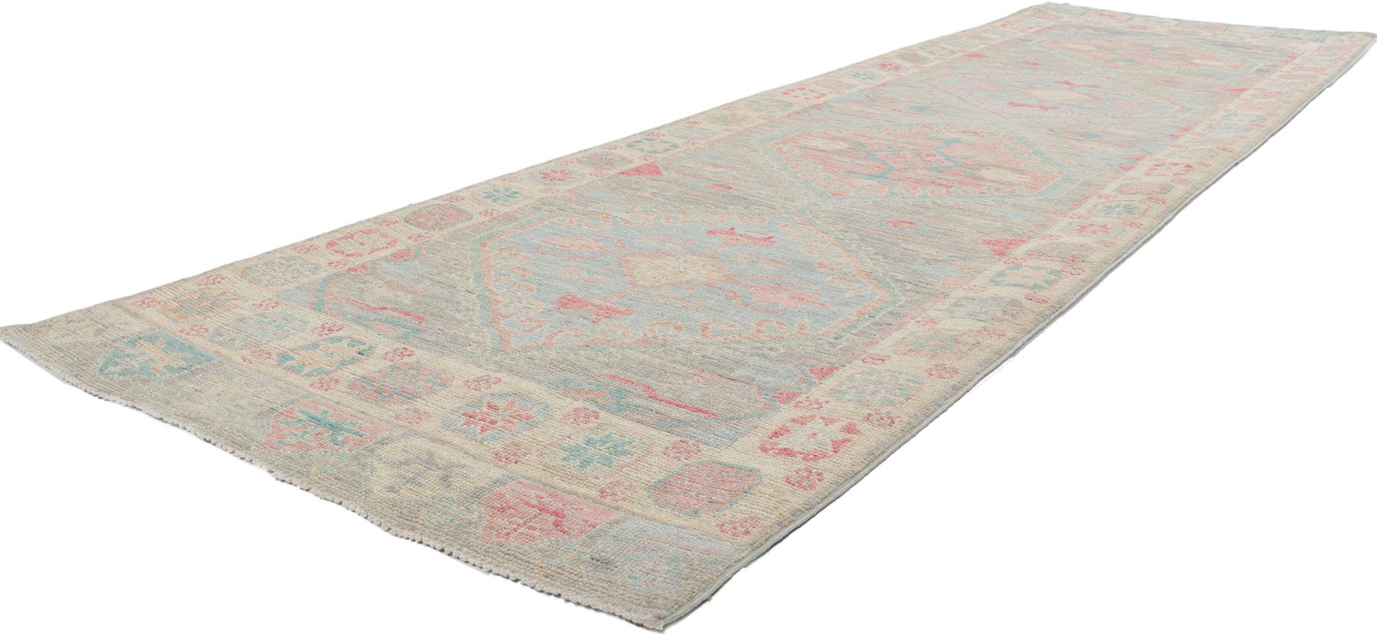80862 New Contemporary Oushak runner, 03'00 x 10'02.
This hand-knotted wool contemporary Oushak hallway rug features an all-over botanical pattern composed of amorphous organic motifs spread across an abrashed bluish-gray field. It is enclosed with
