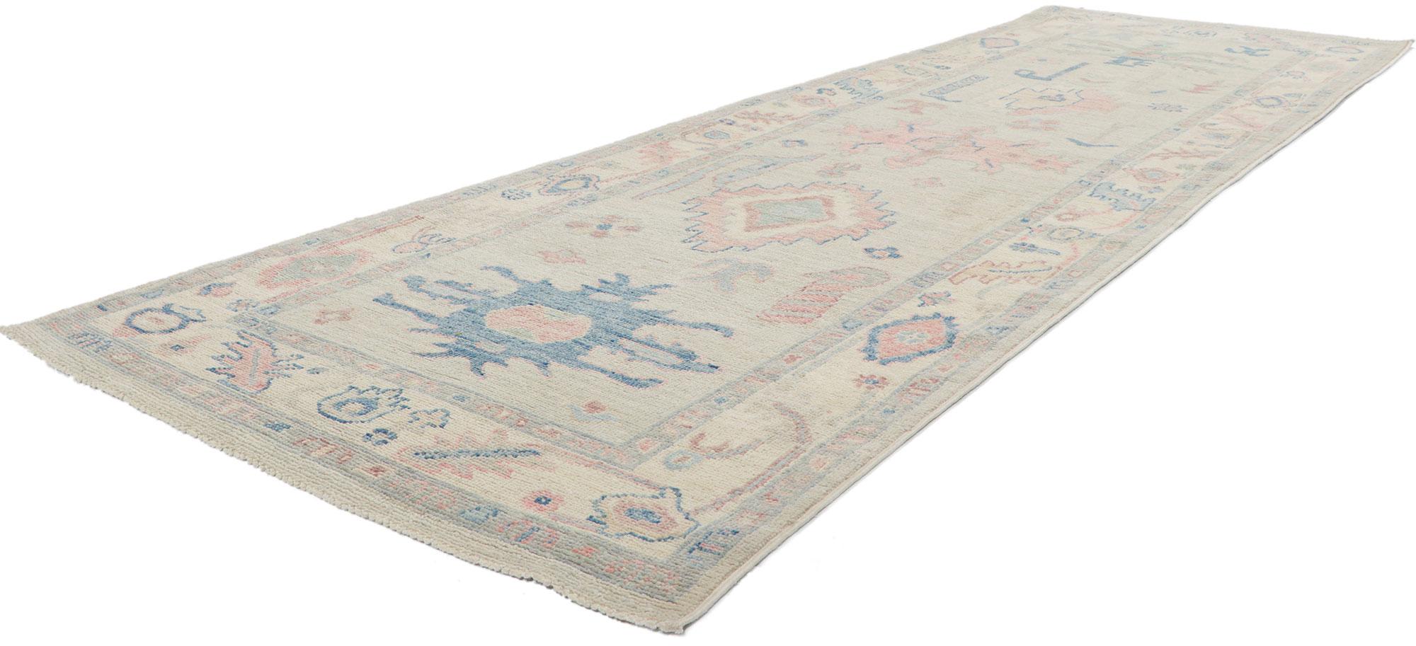 80861 ?New Contemporary Oushak Runner, 03'00 x 09'10. This hand-knotted wool contemporary Oushak hallway rug features an all-over botanical pattern composed of amorphous organic motifs spread across an abrashed oatmeal colored field. It is enclosed