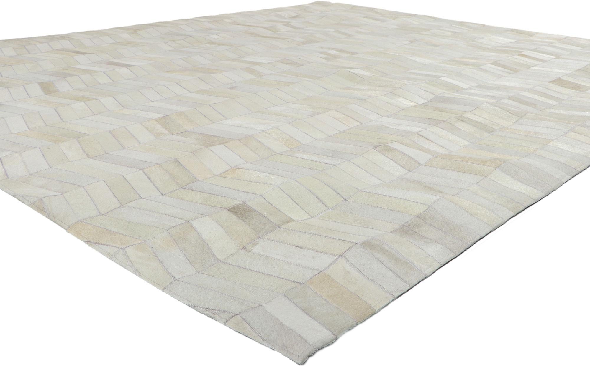30910 New Contemporary Patchwork Cowhide rug with Modern style 08'00 x 09'10. Call the wild indoors and bring a sense of adventure home with this handcrafted cowhide rug. Showcasing a modern design, incredible detail and texture, this leather