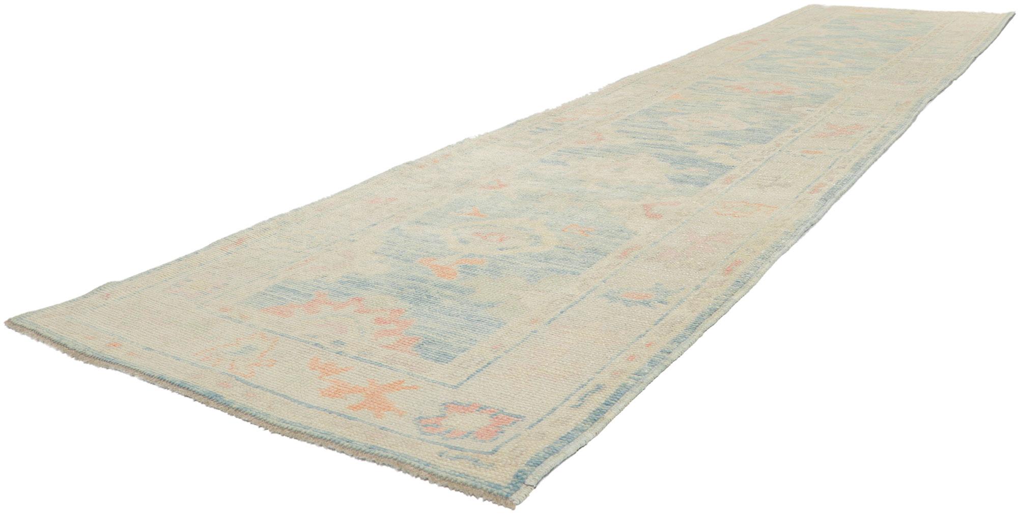 53824 New Contemporary Turkish Oushak rug runner, 02'10 x 13'00. This hand-knotted wool contemporary Turkish Oushak runner features an all-over botanical pattern composed of amorphous organic motifs spread across an abrashed sky blue field. It is