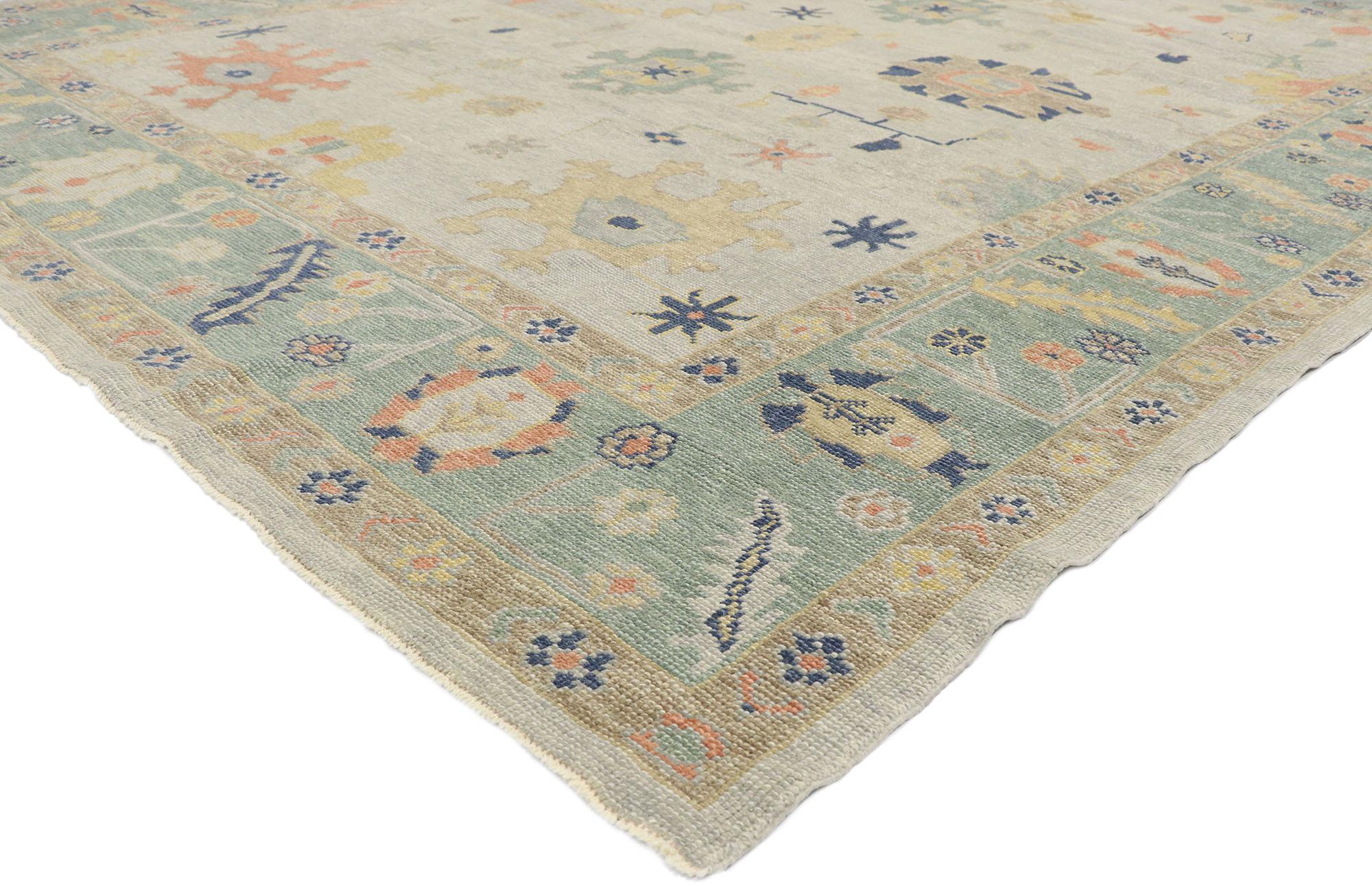 53504, new contemporary Turkish Oushak rug with Modern Coastal style. This hand-knotted wool contemporary Turkish Oushak rug features an all-over botanical pattern spread across an abrashed light gray field. An array of botanical motifs decorates