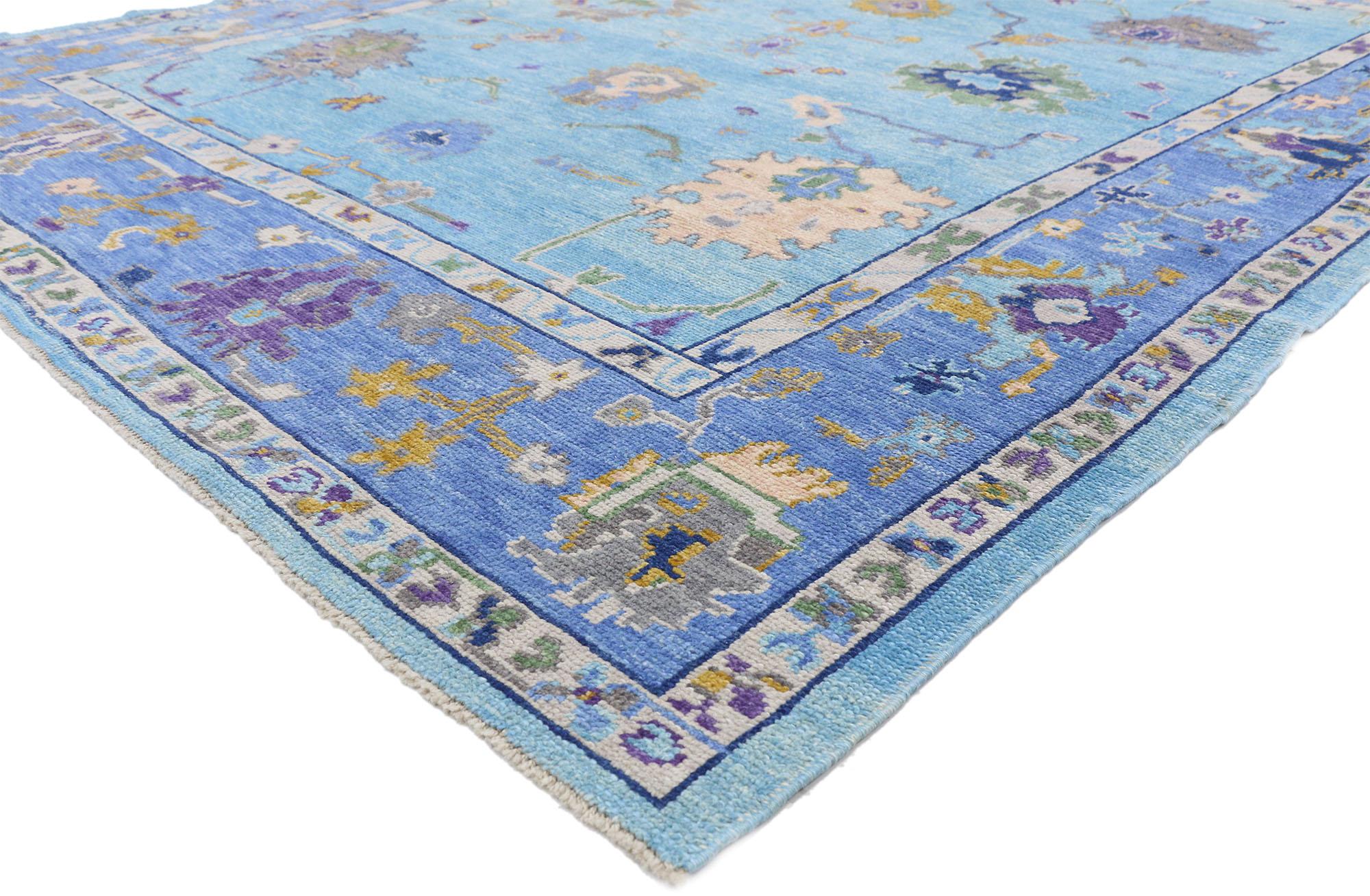 52428, new contemporary Turkish Oushak rug with modern colors and Expressionist style. This hand knotted wool contemporary Turkish Oushak rug features a vibrant all-over floral pattern spread across an abrashed sky blue field. Harshang palmettes,