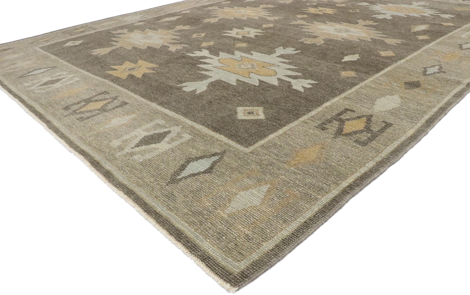 53434 Modern Earth-Tone Turkish Oushak Rug, 09'03 x 12'01. 
Subtle Southwest meets luxury lodge in this hand knotted wool Turkish Oushak rug. The Aztec pattern and earth-tone colors woven into this piece work together creating a cozy, inviting and