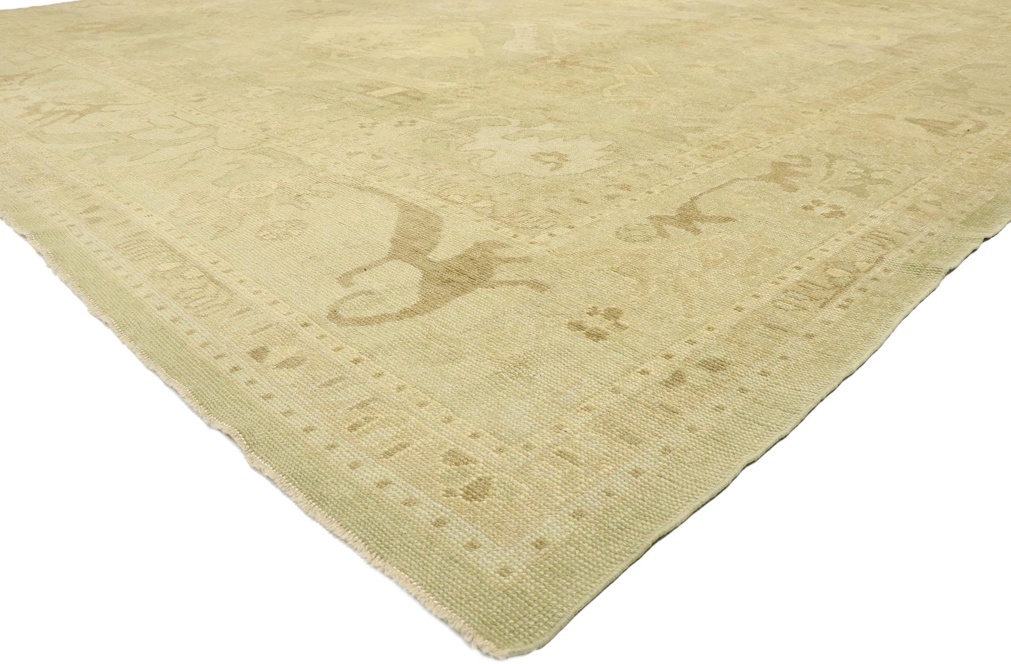 51598, Modern Oushak Turkish Rug, 12'09 x 17'00. 
This hand knotted wool Turkish Oushak rug features an all-over botanical pattern composed of Harshang-style motifs, organic and amorphous shapes spread across a pale mossy background. It is enclosed