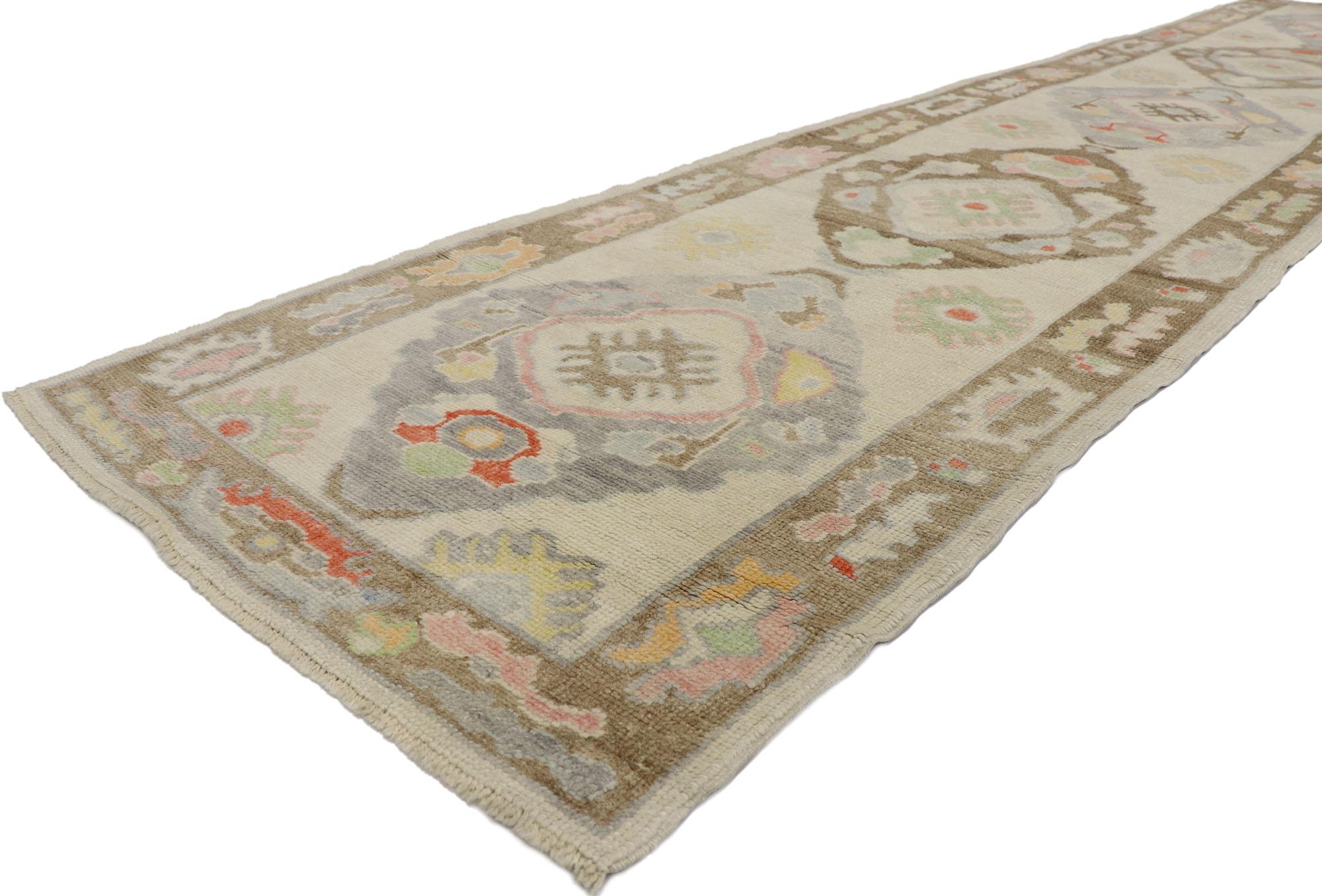 53592 new contemporary Turkish Oushak Runner 03'01 x 15'00. Warm and inviting with a splash of soft colors, this hand-knotted wool contemporary Turkish Oushak runner beautifully embodies bohemian style. The abrashed light gray field features an