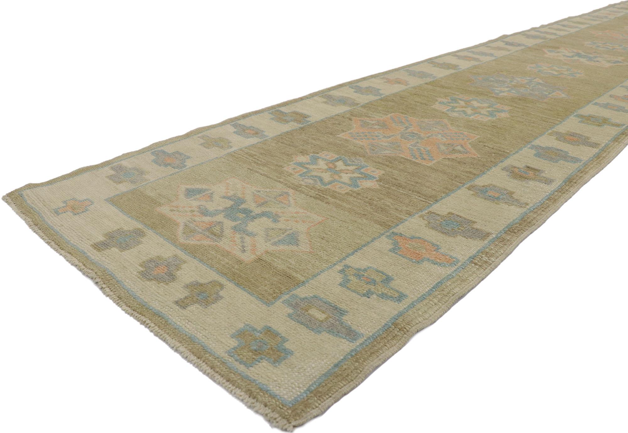 53585 New Contemporary Turkish Oushak Runner with Modern Style 03'01 x 15'11. This hand-knotted wool contemporary Turkish Oushak runner features an all-over geometric pattern spread across an abrashed tan and taupe striated field. An array of tribal